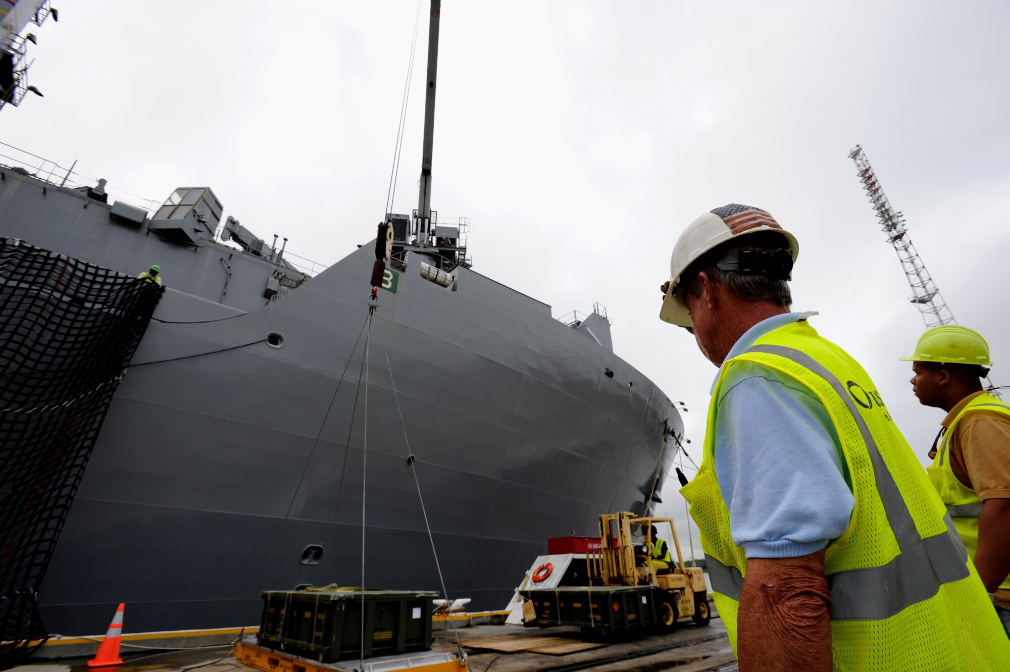 Dock workers move ammunition and supplies from Joint Base Charleston-Weapons Station to Military Sealift United States Navy Ship Lewis and Clark (T-AKE-1), Dry cargo/Ammunition Ship, during a recent ammunition onload.  More than 1,700 pallets were received by USNS Ship Lewis and Clark during the onload.  It had been sixteen years since a ship has been pre-positioned at Joint Base Charleston-Weapons Station. (U.S. Air Force photo by Staff Sgt. Rasheen A. Douglas)