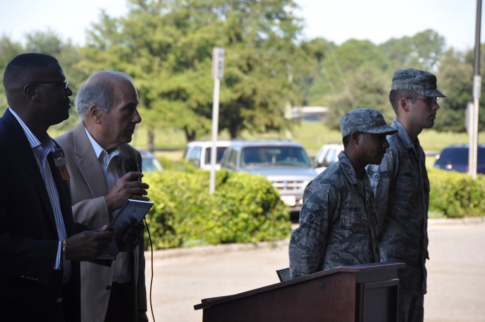 Airman First Class Kejuan Stanley and Senior Airman Sonney Ornelaes (far right) stand at the Sam's Club annual community event in honor of 9/11. Stanley and Ornelaes represented the 916th Maintenance Group at the event on Sept. 11, 2012. (USAF photo by Maj. Shannon Mann, 916ARW/PA)