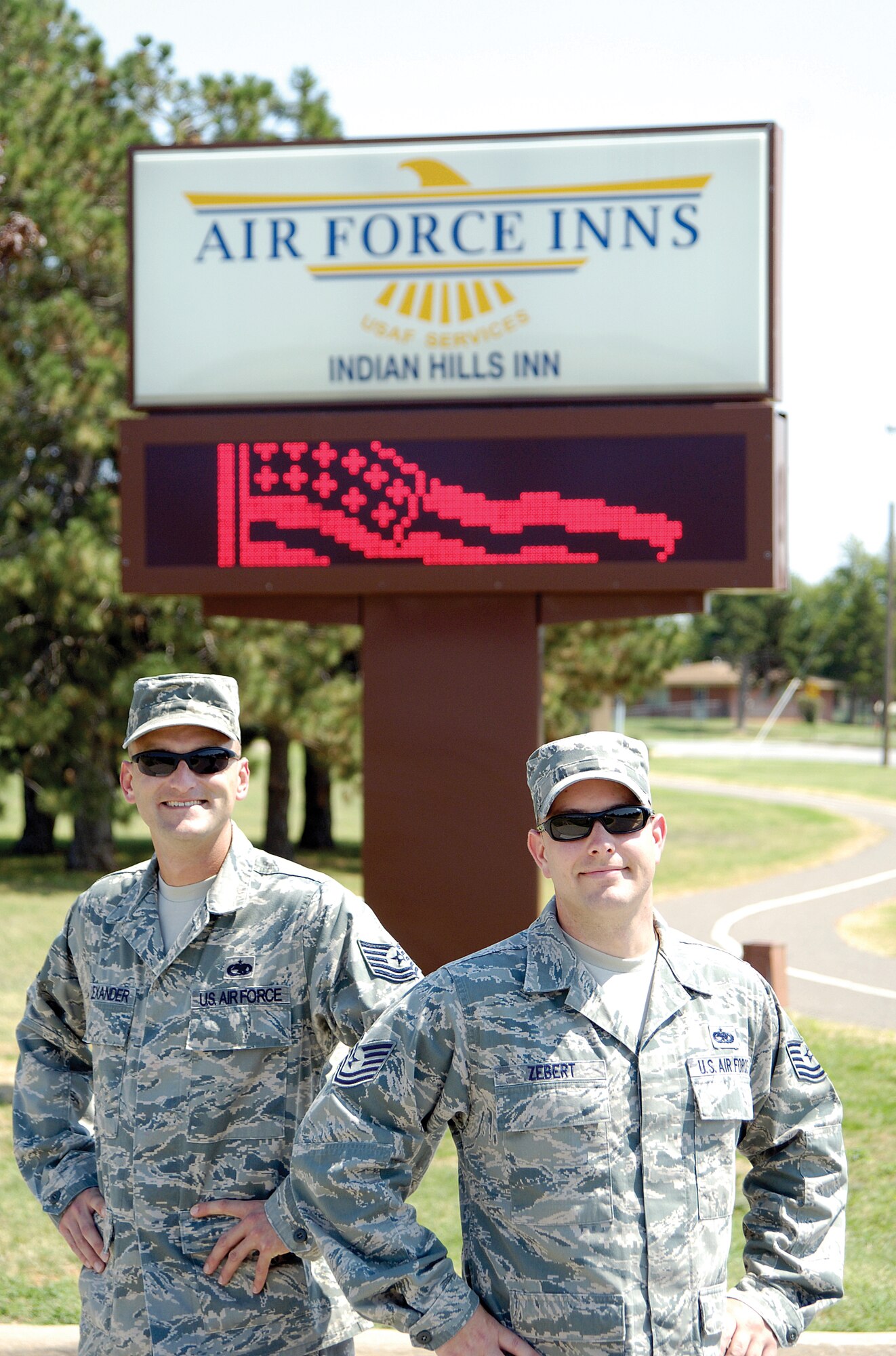 Tech. Sgts. Patrick Alexander, left, and Mitchell Zebert, were asked if they could fix the Tinker Indian Hills Lodging sign that base leadership was told needed replacing — at $20,000. The 552nd Maintenance Group Air Force Repair Enhancement Program NCOs used their skills, spent $2 on parts, and had the lodging sign once again welcoming visitors. The men were on a roll and turned their talents to two other broken base marquees, repairing each in real examples of the Team Tinker spirit. (Air Force photo by Margo Wright)