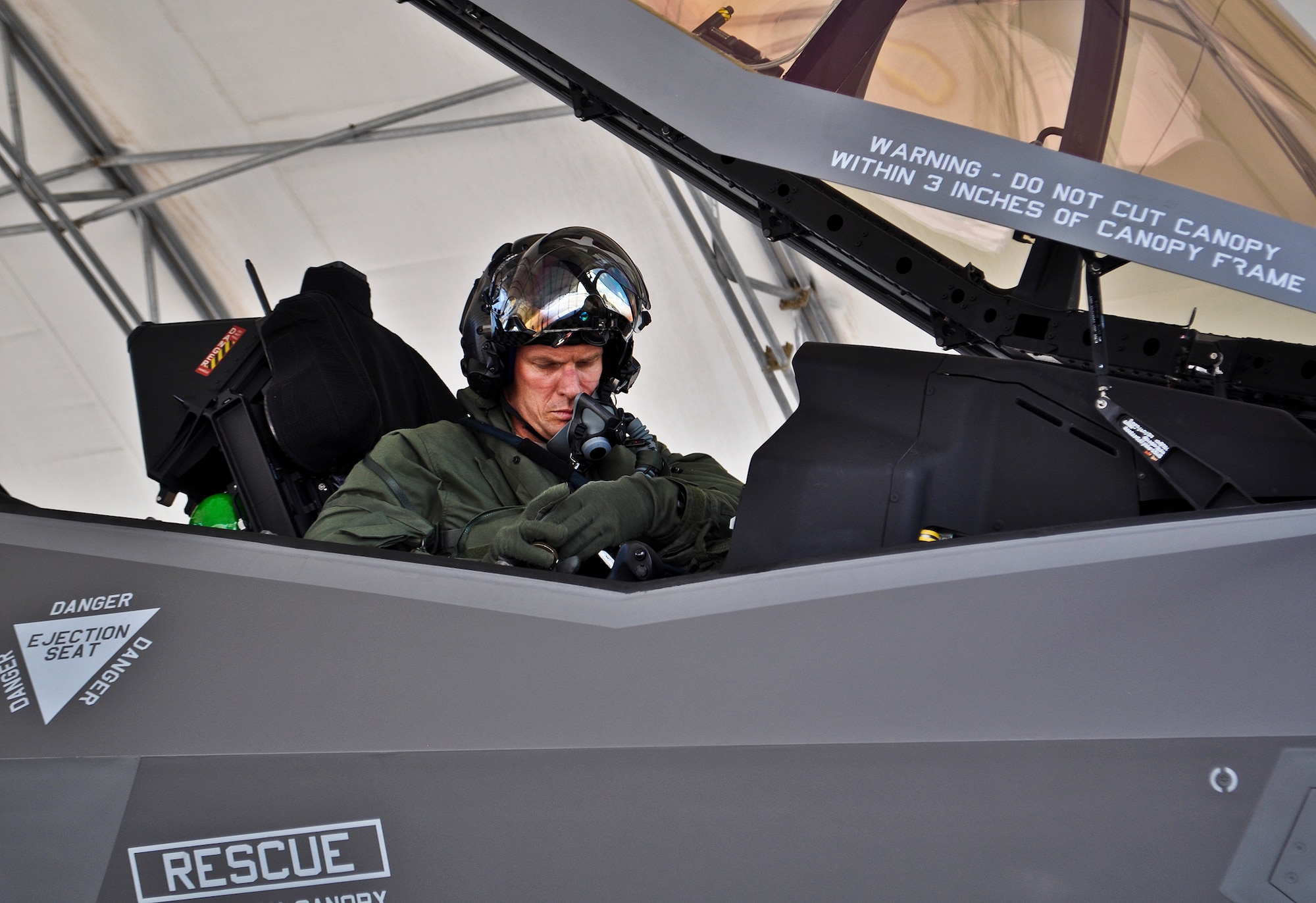 Lt. Col. Lee Kloos, 58th Fighter Squadron commander, prepares to exit an F-35A Lightning II joint strike fighter, after a successful sortie May 31, 2012. Kloos is the first non-developmental test pilot to fly the JSF, and now trains other 33rd Fighter Wing initial cadre pilots to fly the F-35. (U.S. Air Force photo/Maj. Karen Roganov)