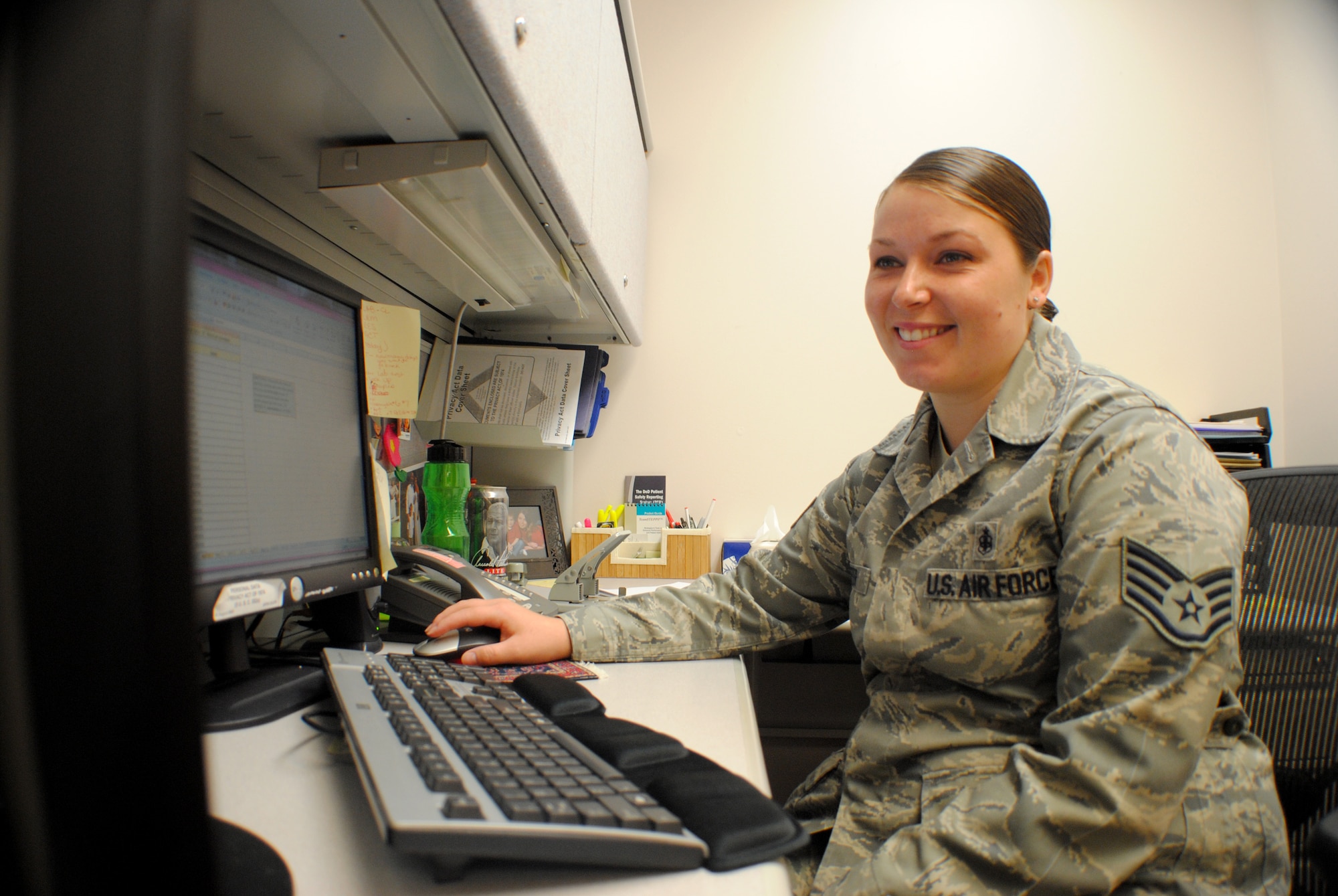 Staff Sgt. Meghan Reiter, 319th Medical Operations Squadron, reviews new statistics about communicable diseases from the Center for Disease Control, Sept. 5, 2012, at the medical clinic on Grand Forks Air Force Base, N.D.  Reiter maintains oversight of several medical related programs for the base such as the physical health assessment program. She processes an average of approximately 115 PHAs per month. (U.S. Air Force photo/Senior Airman Luis Loza Gutierrez)