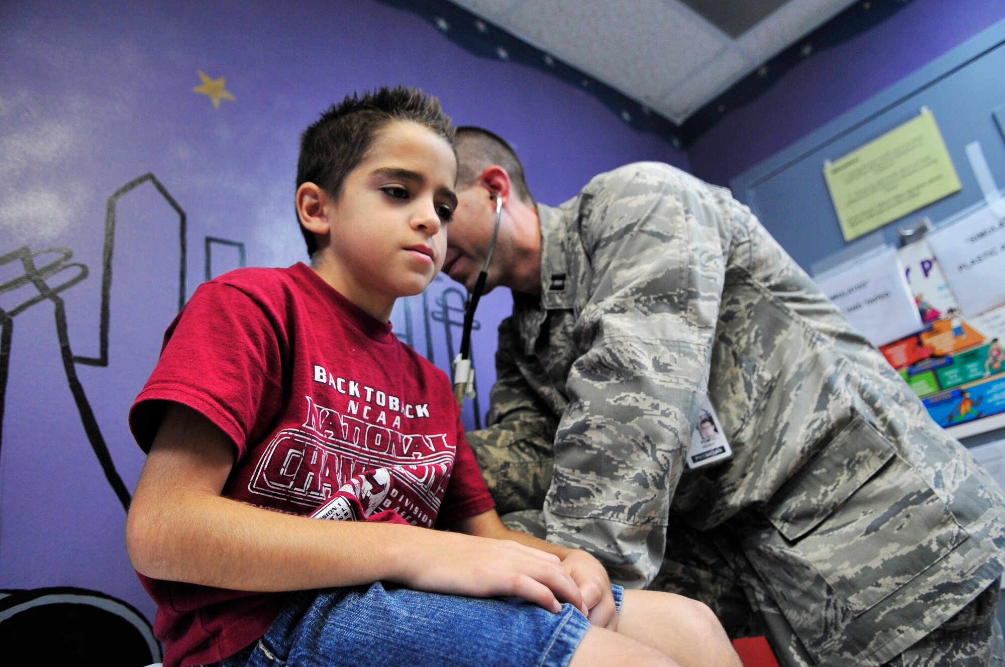 U.S. Air Force Capt. Adam Powell, 20th Medical Group pediatrician, examines Hiram Gascot at Shaw Air Force Base, S.C., Sept. 5, 2012.  The pediatrics clinic has been at Shaw for 14 years and its staff consists of six enlisted personnel, three officers and one civilian. (U.S. Air Force photo by Airman Nicole Sikorski/Released)