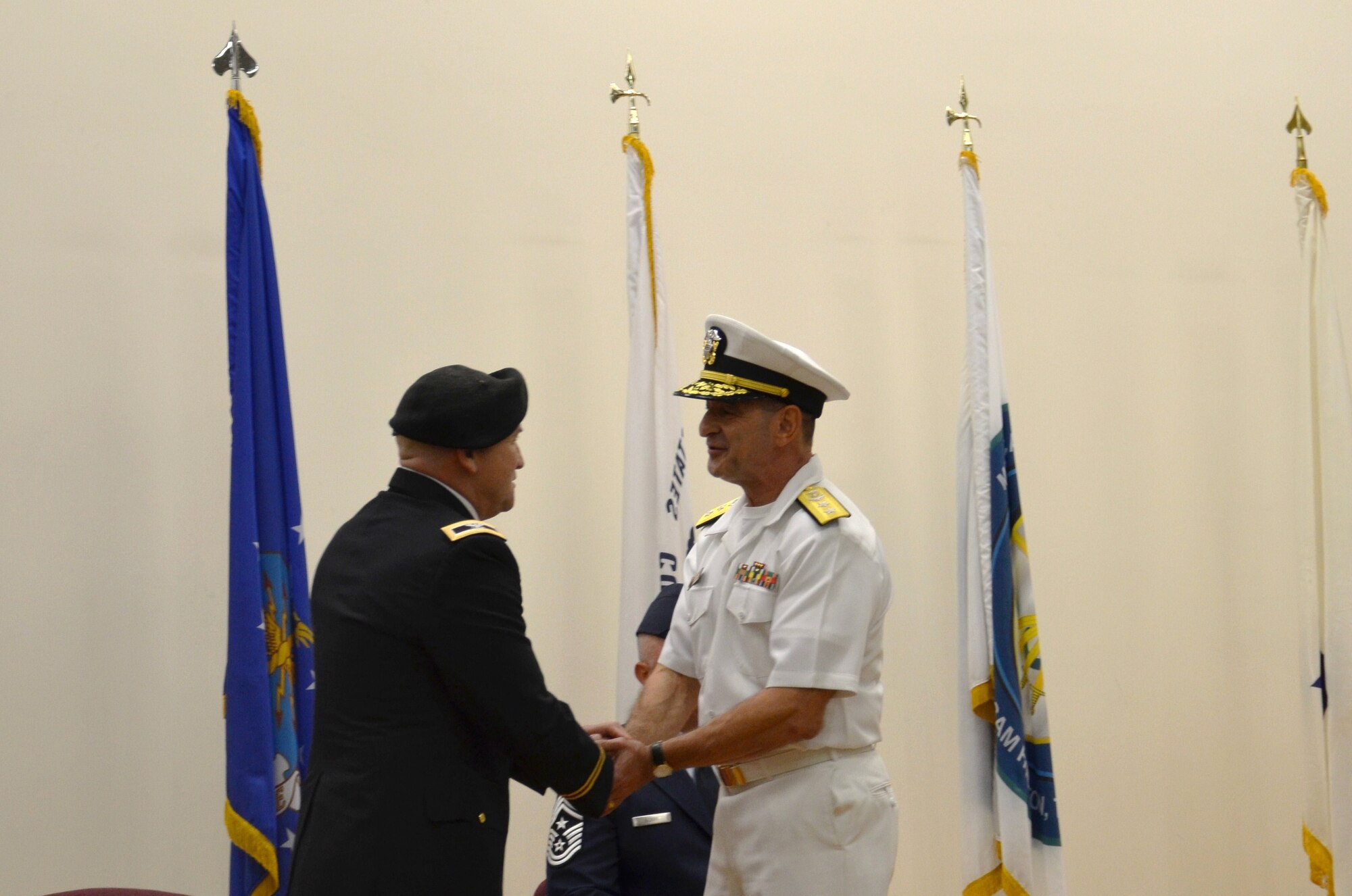 Navy Rear Adm. William M. Roberts became the second commandant of the Medical Education & Training Campus (METC) during an Assumption of Commandant ceremony September 7. Roberts (right) relieves Army Col. Gino Montagno, METC deputy commandant, who served as interim commandant during the past three months. METC trains the world's finest medics, corpsmen, and techs; supporting our nation's ability to engage globally. (Photo by Lisa Braun/released)
