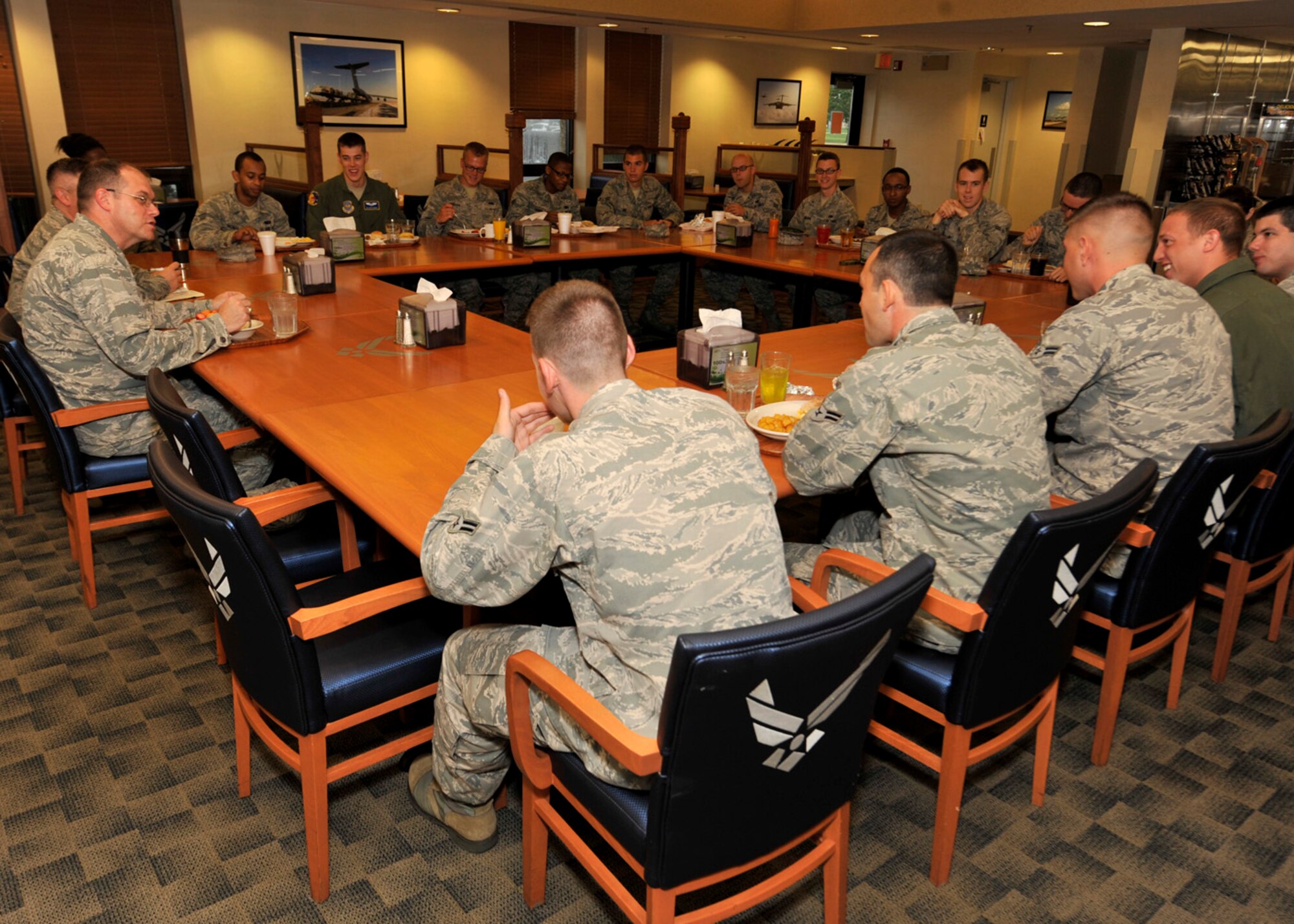 Col. Richard Moore, commander of the 436th Airlift Wing, listens to a question posed by Airman Sep. 6, 2012, at the Dining Facility on Dover Air Force Base, Del. Col. Moore had breakfast with Airmen to hear their concerns and answer their questions. (U.S. Air Force photo by Tech. Sgt. Chuck Walker)