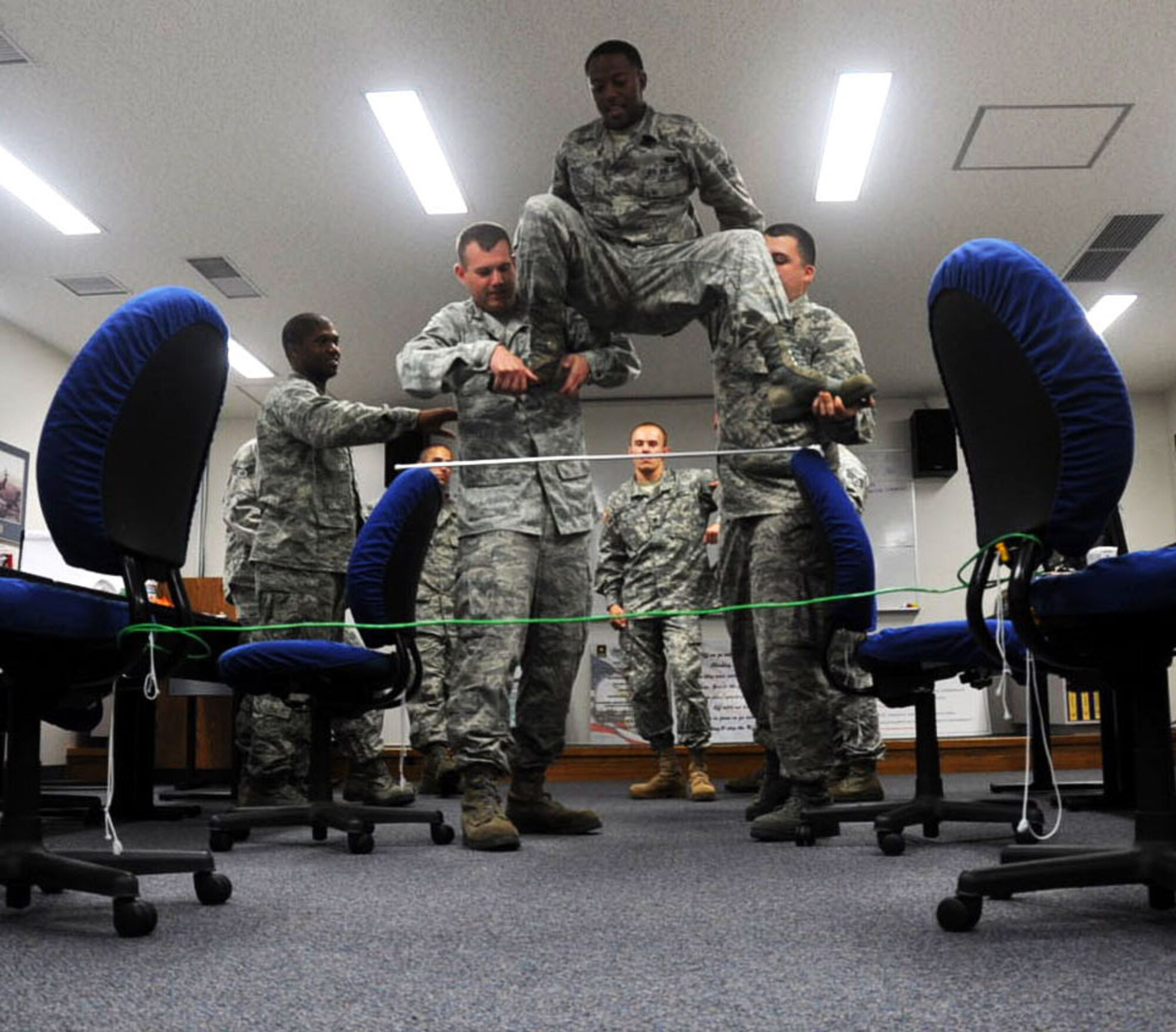 Airman Leadership School students attempt to solve a strategic leadership exercise at Misawa Air Base, Japan, Sept. 11, 2012. ALS students go through 192 hours, or 24 days, of classes designed to strengthen their communication and leadership skills. (U.S. Air Force photo by Airman 1st. Class Kenna Jackson/Released)