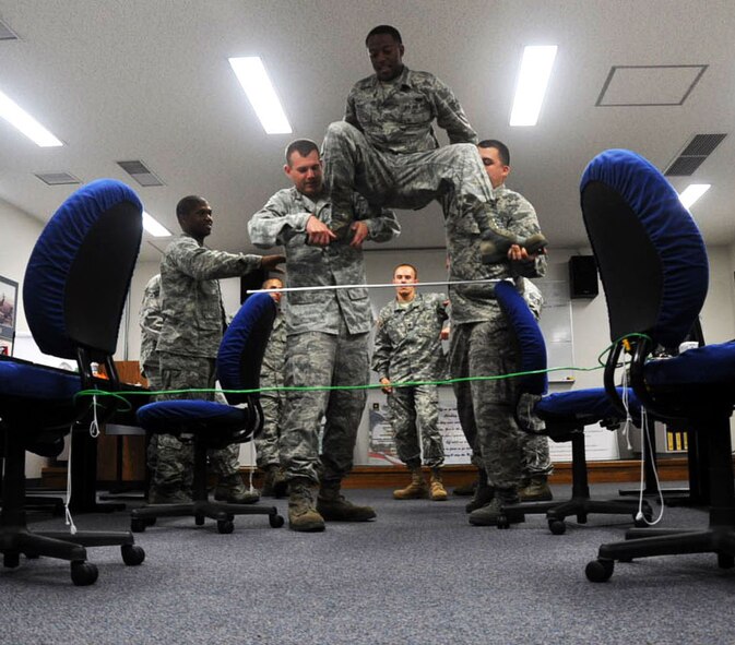 Airman Leadership School students attempt to solve a strategic leadership exercise at Misawa Air Base, Japan, Sept. 11, 2012. ALS students go through 192 hours, or 24 days, of classes designed to strengthen their communication and leadership skills. (U.S. Air Force photo/Airman 1st. Class Kenna Jackson) 
