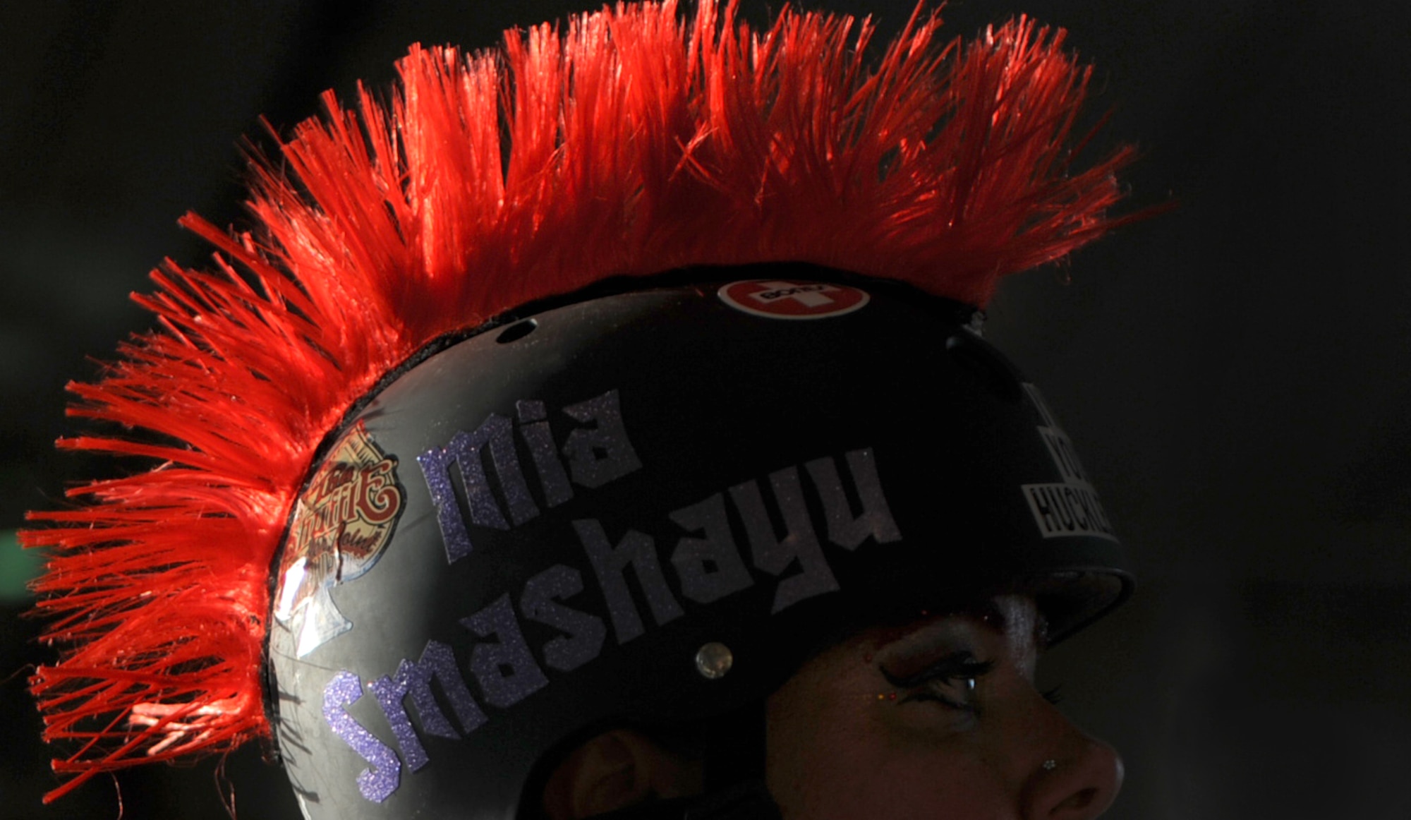 A member of the Habu Hellions, a roller derby team with the Kokeshi Roller Dolls, stares down her opponents before their bout at Kadena Air Base, Japan, Sept. 8, 2012. The bout was held inside Kadena's Marine Wing Liaison hangar to help raise money for the Air Force Ball being held at the Rocker NCO Club Sept. 15. More than $1,000 was raised for the event. (U.S. Air Force photo/Staff Sgt. Sara Csurilla)