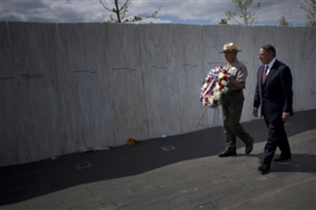 Secretary of Defense Leon E. Panetta walks with a Park Ranger as he prepares to lay a wreath at the Flight 93 National Memorial Plaza Wall of Names in Shanksville, Pa, on Sept. 10, 2012.   Panetta will lay the wreath to honor the passengers and crew of United Airlines Flight 93.  