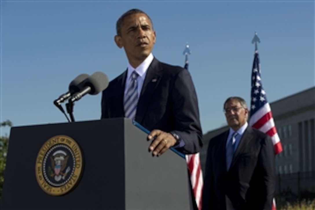 President Barack Obama addresses the audience at a ceremony commemorating the 11th anniversary of the Sept. 11, 2001, terrorist attacks on the Pentagon on Sept. 11, 2012.  Secretary of Defense Leon E. Panetta, right, hosted the president for the Pentagon Ceremony.  