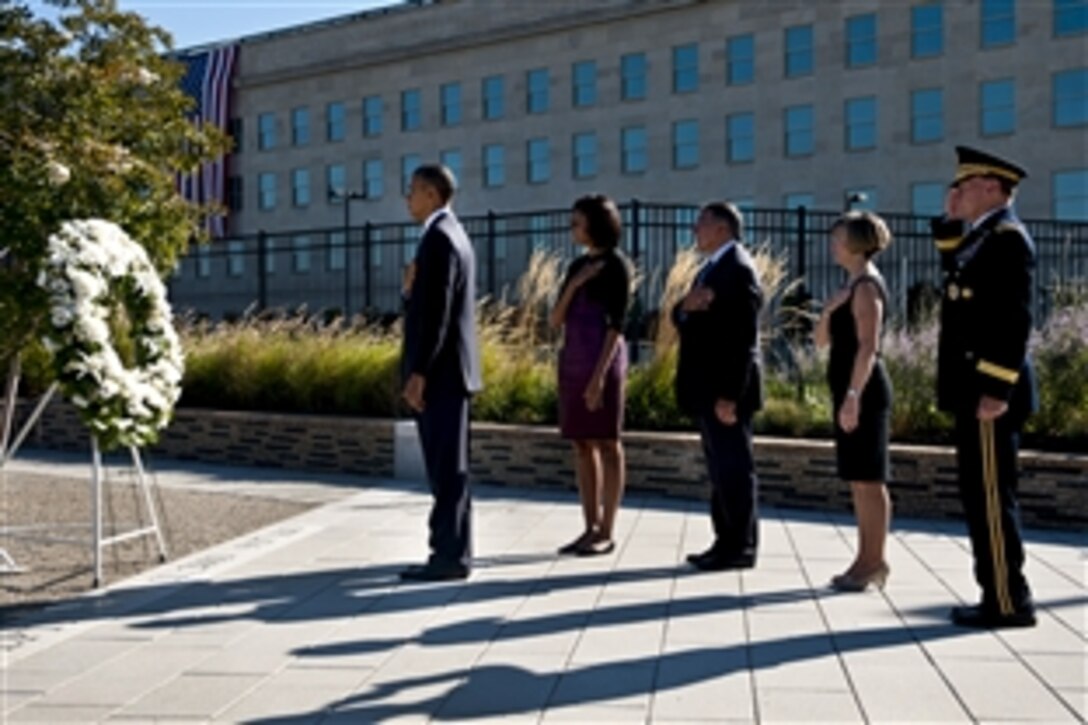 President Barack Obama, First Lady Michelle Obama, Defense Secretary Leon E. Panetta, Deanie Dempsey and Army Gen. Martin E. Dempsey, chairman of the Joint Chiefs of Staff, lay a wreath to commemorate the 11th anniversary of the 9/11 terrorist attacks at the Pentagon, Sept. 11, 2012.