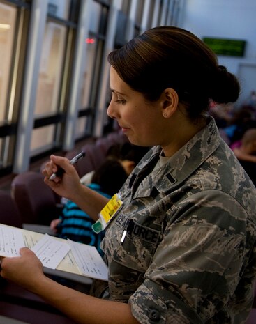 U.S. Air Force 1st Lt. Nancy Branch, 99th Medical Group pediatric clinic
nurse manager, screens patients for scabies  Sept. 12, 2012, at the Mike
O'Callaghan Federal Medical Center here. The pediatric clinic provided walk-in treatment to people exhibiting symptoms of scabies Sept.
13 from 12  to 4 p.m. (U.S. Air Force photo by Senior Airman Daniel
Hughes) 