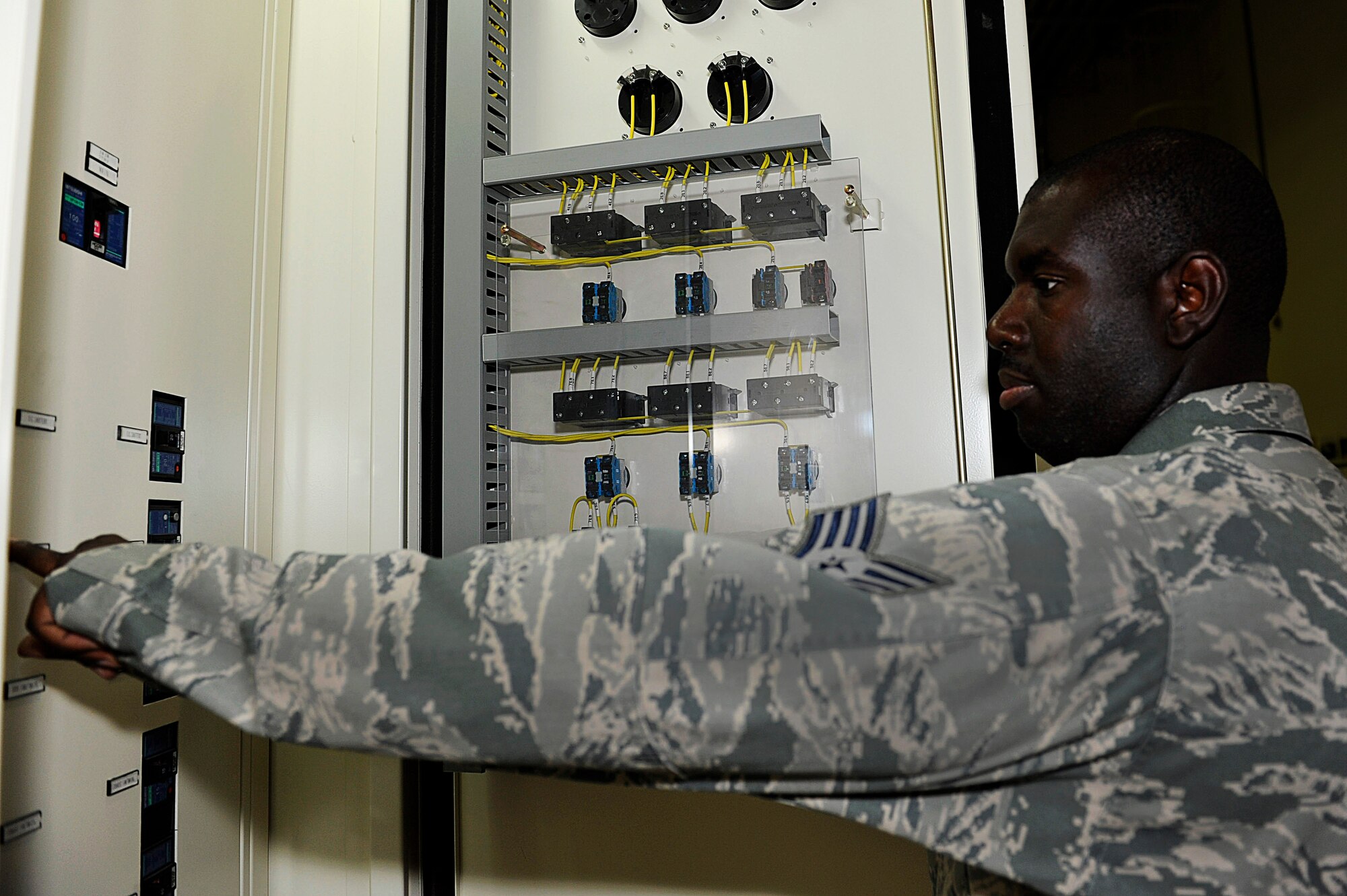 U.S. Air Force Staff Sgt. Ancele Prince, 18th Logistic Readiness Squadron
Vehicle Management Flight facility manager, turns off power to unused shop
machines at the facility on Kadena Air Base, Japan, Sept. 12, 2012. Prince
and Tamotsu Arime, the alternate facility manager for the shop, recently
earned the Energy Warrior Award for their efforts to conserve energy in
their building. Based on statistics from early September, Kadena personnel
met a 5.9-percent energy reduction goal over the last two years saving the
Air Force nearly $5 million in energy bills. (U.S. Air Force photo/Airman
1st Class Malia Jenkins)