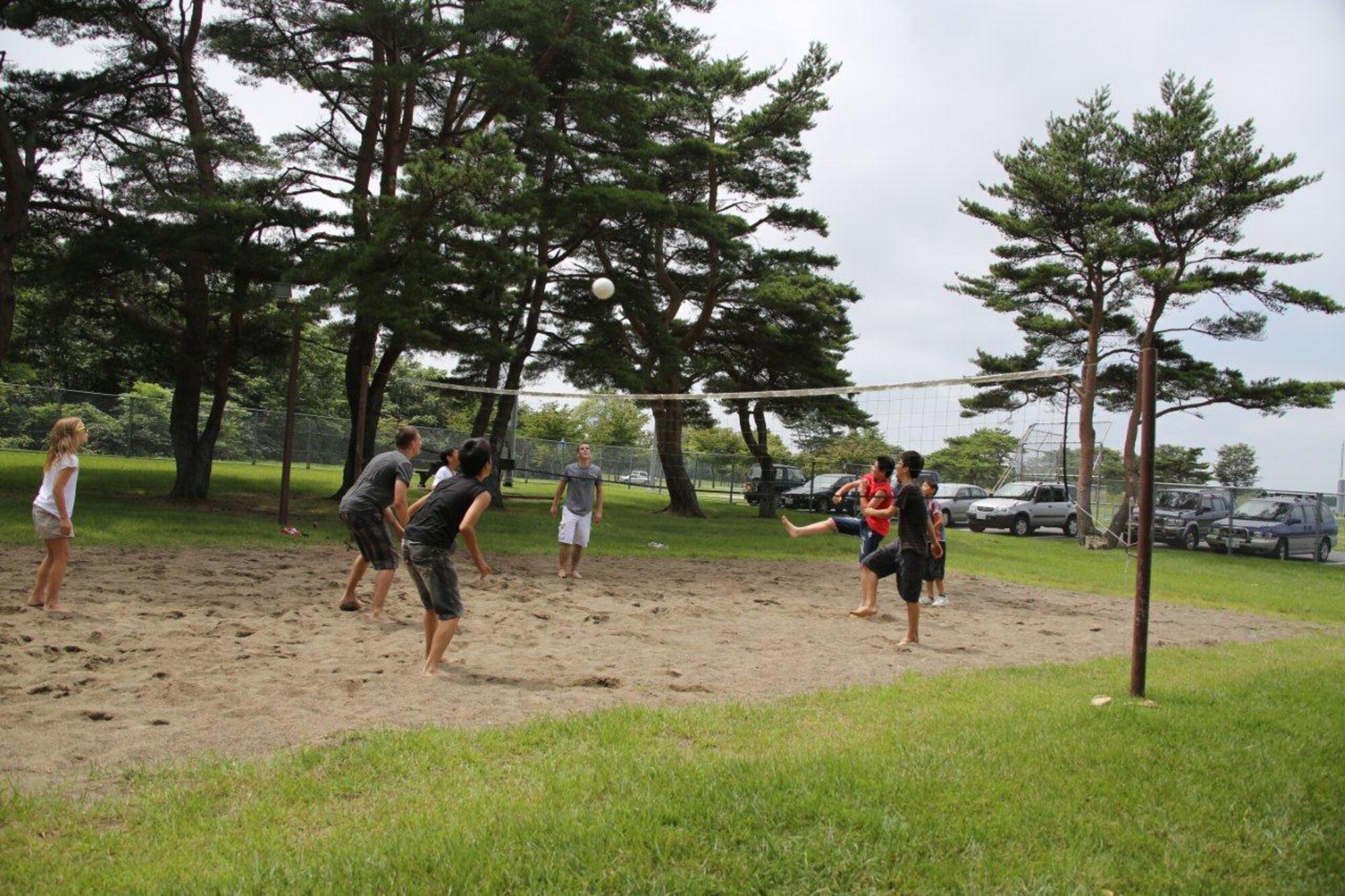 Members of the 35th Logistics Readiness Squadron play volleyball with children from Fuji Seiboen Orphanage at Leftwich Park in Aomori, Japan on Aug. 18, 2012. The 35 LRS has been working with the orphanage for 45 years and have established a strong bilateral relationship. (Courtsey photo/Released)
