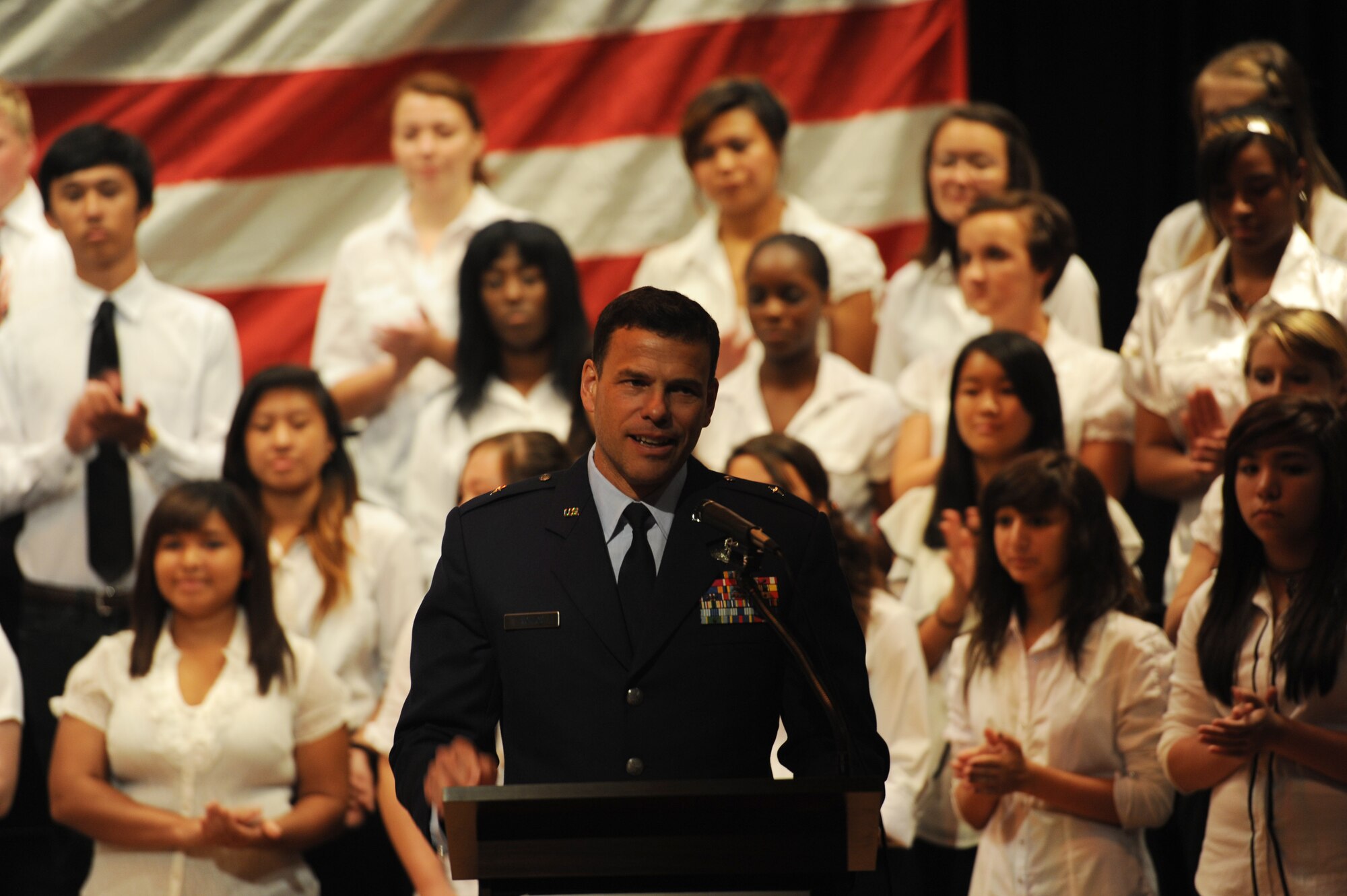 U.S. Air Force Brig. Gen. Matt Molloy, 18th Wing commander, gives a speech in front of more than 60 choir members at Kadena High School during a Patriot Day celebration on Kadena Air Base, Japan, Sept. 12, 2012. The high school has paid tribute to the victims of 9/11 for 11 years. (U.S. Air Force photo/Airman 1st Class Malia Jenkins)  