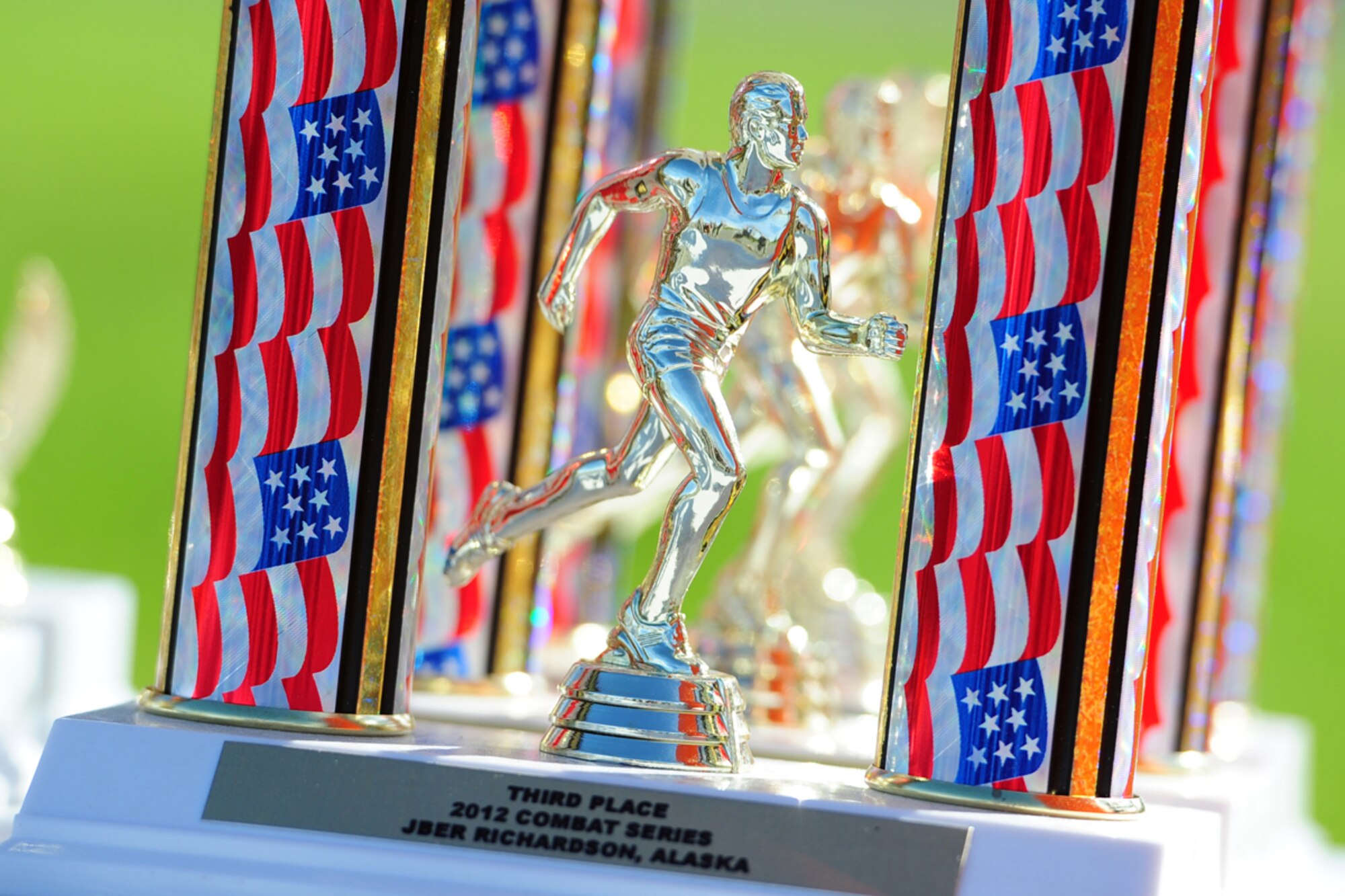 Trophies for the best teams on the Combat Cross-Country Relay rest on a table prior to
the race Sept. 7. The relay consisted of five five-man teams in Army Combat Uniforms
and combat boots racing for the best time with 35-lb. rucksacks. (U.S. Air Force photo/
Justin Connaher)