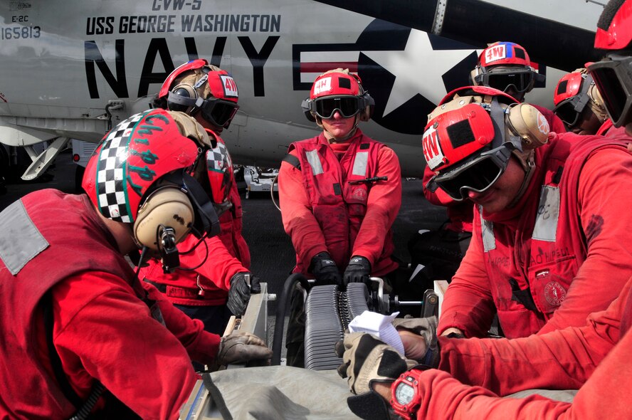 PACIFIC OCEAN (Sept. 12, 2012) Aviation ordnancemen
calibrate the timing on a link-less ammunition loading system for an
aircraft weapon system upload during flight operations aboard the U.S.
Navy's forward-deployed aircraft carrier USS George Washington (CVN 73) in
support of Valiant Shield 2012 (VS12). VS12 is an integrated joint training
exercise that offers the opportunity to integrate Navy, Air Force and Marine
Corps assets in a blue-water environment. (U.S. Navy photo by Mass
Communication Specialist Seaman Apprentice Brian H.
Abel/RELEASED)


