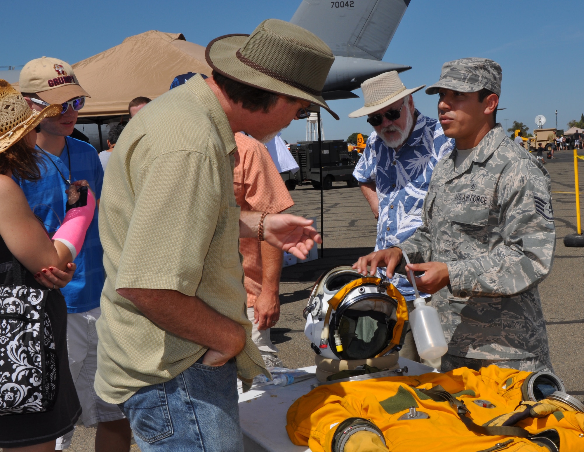 U.S. Air Force Staff Sgt. Willy Campos, 9th Physiological Support Squadron, explains the unique characteristics of the full pressure suits worn by U-2 Intelligence Reconnaissance and Surveillance aircraft pilots at the Capital City Air Show at Mather Airport, Sacramento, Calif., Sept. 8, 2012. The suits are very similar to NASA astronaut suits.  (U.S. Air Force photo by Staff Sgt. Robert M. Trujillo)