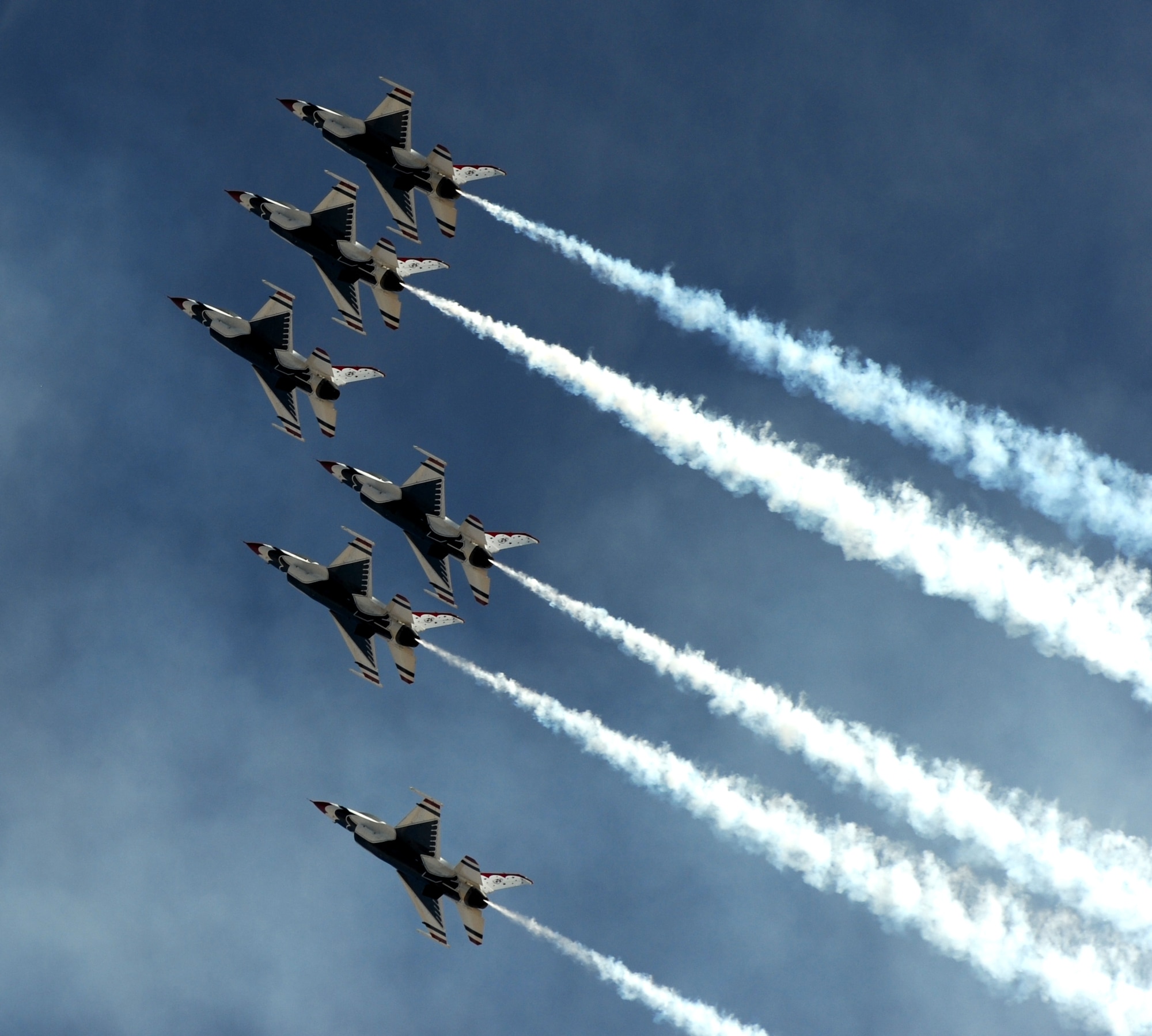 The U.S. Air Force Thunderbirds demonstration team climbs skyward during the Capital City Air Show at Mather Airport, Sacramento, Calif., Sept. 8, 2012. The Thunderbirds often fly just a few feet from wingtip to wingtip during their routines. (U.S. Air Force photo by Staff Sgt. Robert M. Trujillo)