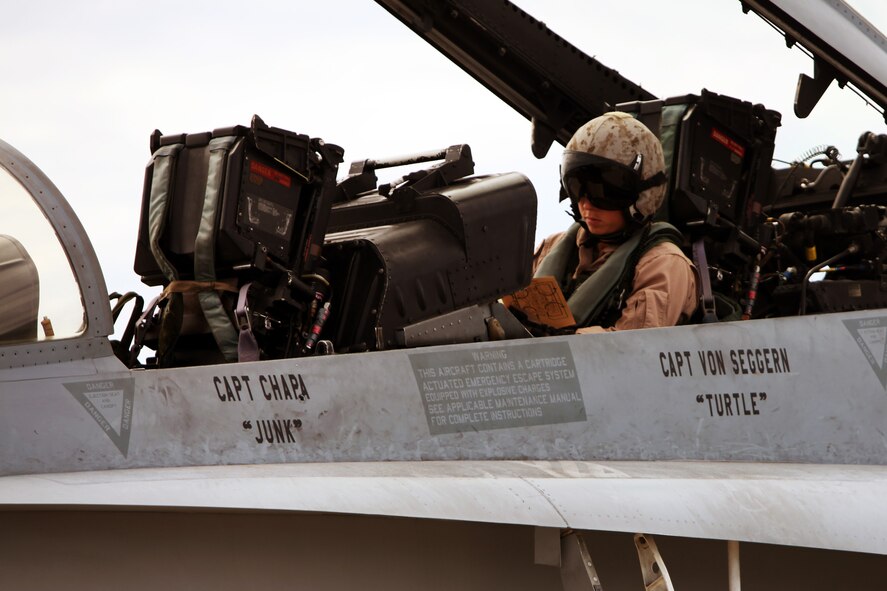 ANDERSEN AIR FORCE BASE, Guam – U.S. Marine Corps Capt. Jon Von Seggern, a weapons systems officer from Marine Fighter Attack Squadron 225 (VMFA(AW)), executes a pre-flight checklist in the cockpit of his F/A-18D Hornet on Andersen Air Force Base, Guam, Sept. 12, in support of Valiant Shield 2012. Valiant Shield is an ongoing biennial joint-service exercise; this is the fourth iteration of the exercise series. The exercise lasts from Sept. 11 - 19, 2012.  (U.S. Marine photo by Lance Cpl. Brianna Turner/ Released)