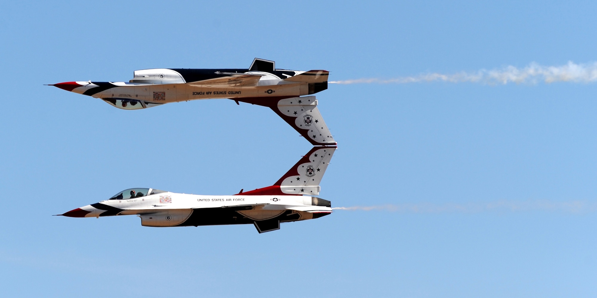The U.S. Air Force Thunderbirds demonstration team performs an inverted maneuver during the Capital City Air Show at Mather Airport, Sacramento, Calif., Sept. 8, 2012. More than 100,000 people attend this annual event. (U.S. Air Force photo by Staff Sgt. Robert M. Trujillo)