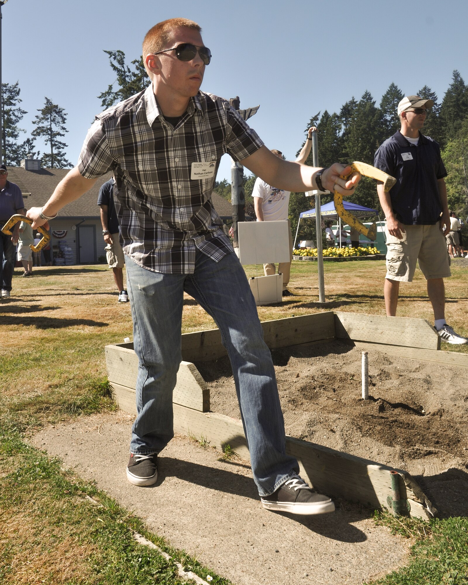 Air Force Staff Sgt. Nathan Carlson, 62nd Aerial Port Squadron aerial transport specialist, participates in a game of horseshoes, Sept. 6, 2012, on Island Home, Wash., during the 50th annual Foofaraw event. Hosted by the Olympia Yacht Club and the Thurston County Chamber of Commerce, the event is a local tradition to honor military service members. (U.S. Air Force Photo/Staff Sgt. Sean Tobin)