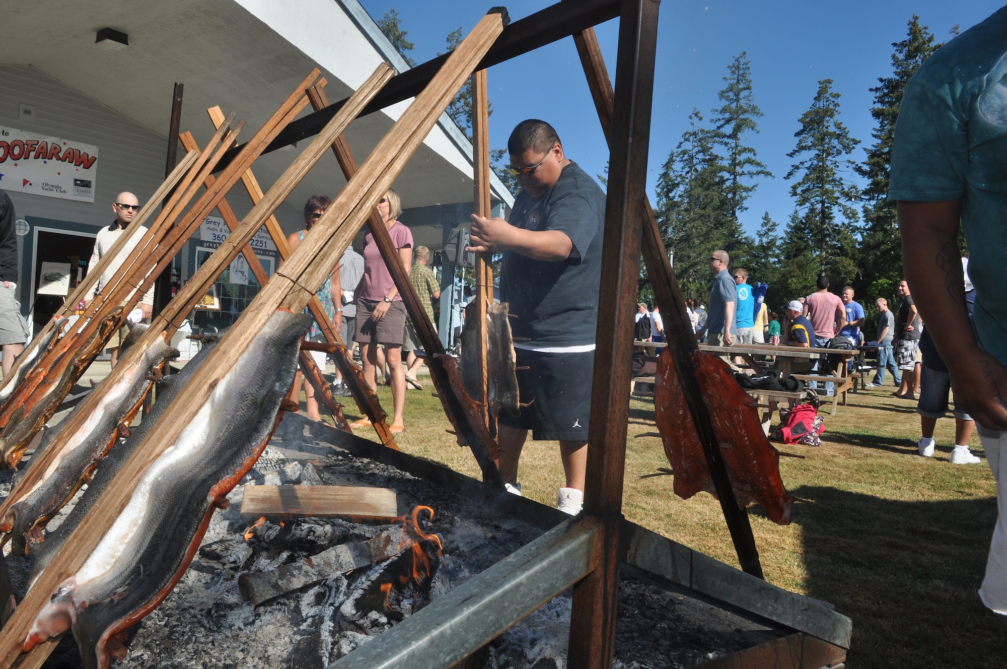 Guy Youchton, a Chehalis tribe member and event volunteer, prepares fresh salmon, Sept. 6, 2012, for guests at the 50th annual Foofaraw event on Island Home, Wash. Hosted by the Olympia Yacht Club and the Thurston County Chamber of Commerce, the event is a local tradition to honor military service members. (U.S. Air Force Photo/Staff Sgt. Sean Tobin)