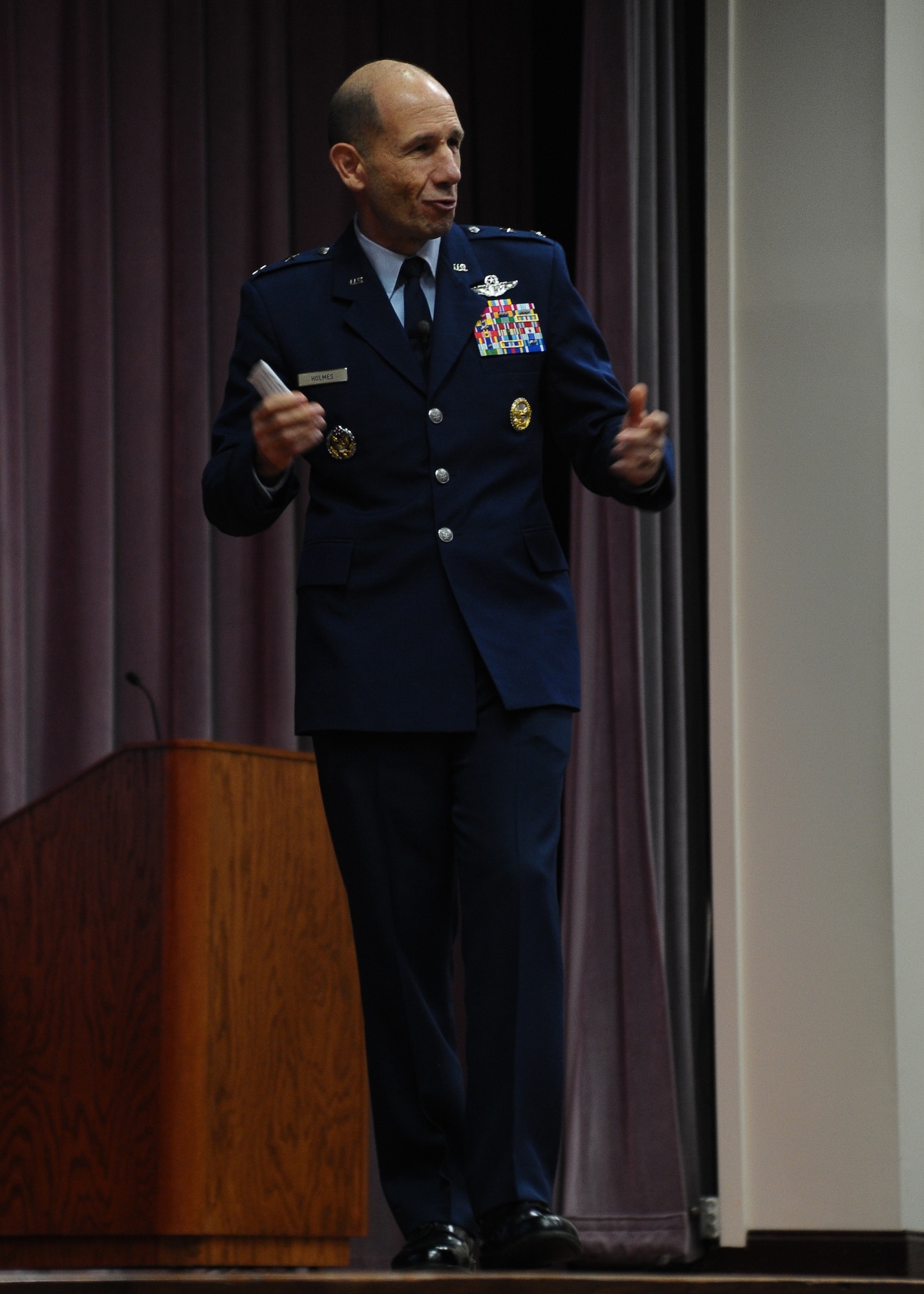 Maj. Gen. Mike Holmes, Assistant Deputy Chief of Staff for Operations, Plans and Requirements, Headquarters U.S. Air Force speaks to the audience during the Specialized Undergraduate Pilot Training Class 12-14 graduation Sept. 7 in Kaye Auditorium.  Holmes told the crowd to abide by the Air Force core values daily and to always look to improve your character. (U.S. Air Force Photo/Airman 1st Class Charles Dickens)