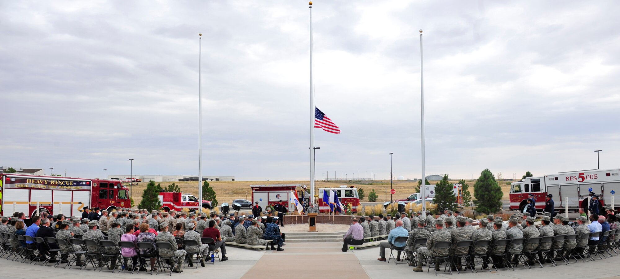 BUCKLEY AIR FORCE BASE, Colo. – Team Buckley members gather at the 460th Space Wing headquarters building for the Patriot Day retreat ceremony Sept. 11, 2012. The ceremony honored the lives lost 11 years ago in the 9/11 terrorist attacks in New York City. (U.S. Air Force photo by Airman 1st Class Darryl Bolden Jr.)