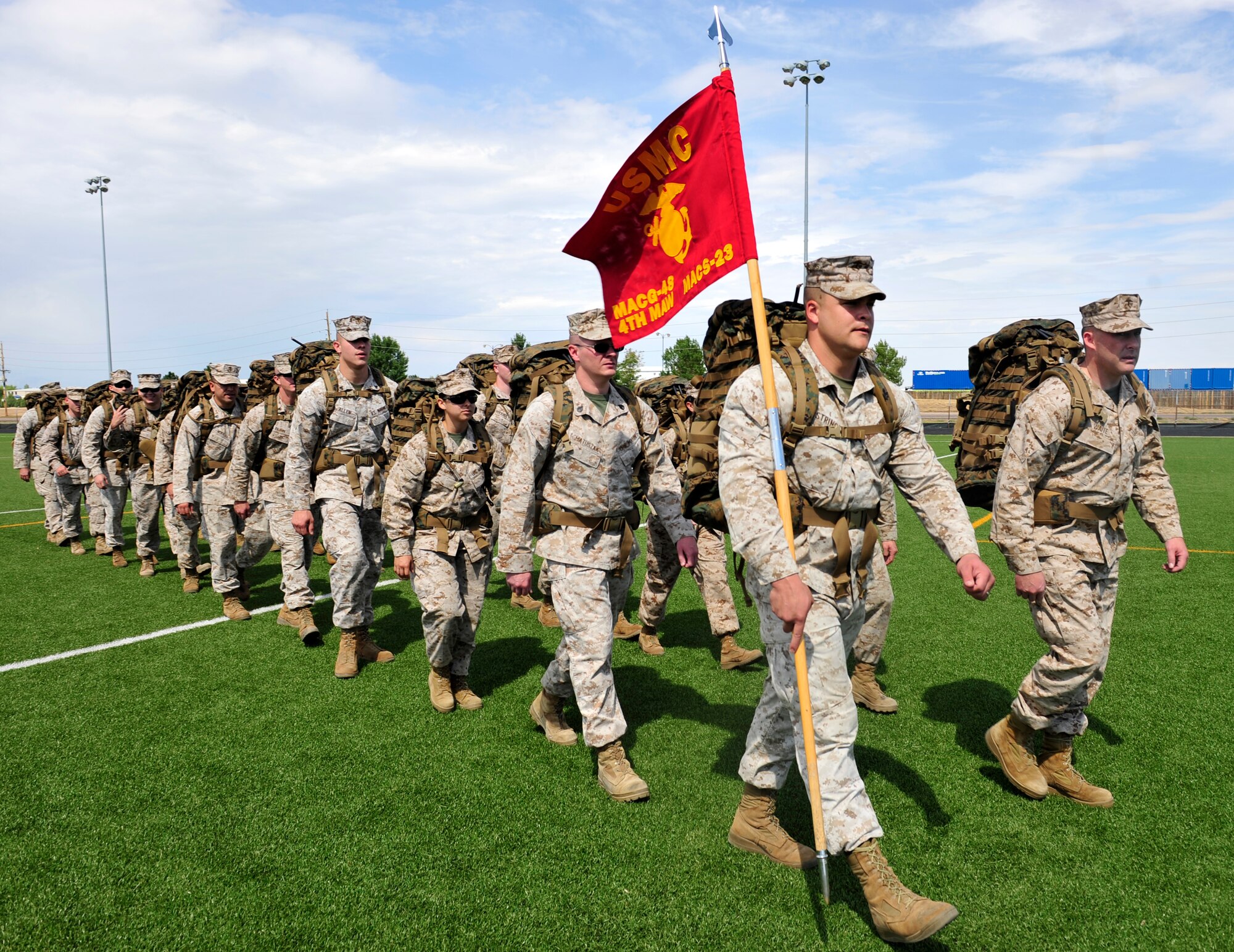BUCKLEY AIR FORCE BASE, Colo. – Marine Air Control Squadron 23 troops start a 5K rucksack march from the fitness field Sept. 11, 2012. The march consisted of ten stations where participants performed exercises that corresponded with facts surrounding 9/11. (U.S. Air Force photo by Airman 1st Class Darryl Bolden Jr.)