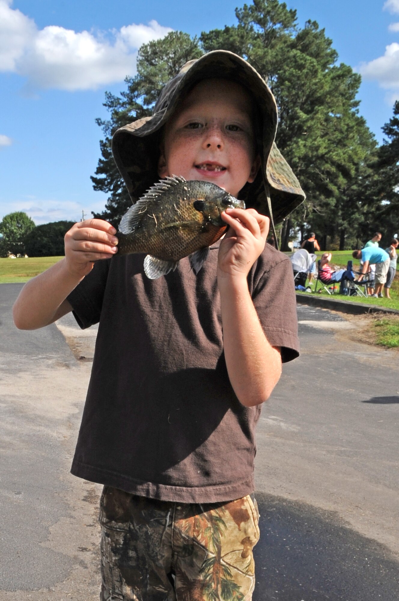 Chase Rake, 6, holds the first fish caught during the Catch & Release Fishing Derby on Seymour Johnson Air Force Base, N.C., Sept. 9, 2012. Team Seymour families came out to enjoy an evening of fishing hosted by 4th Force Support Squadron. Chase is the son of U.S. Air Force 2nd Lt. Keavy Rake, 4th Fighter Wing deputy chief of Public Affairs, and Staff Sgt. Adam Rake, 4th Equipment Maintenance Squadron Repair and Reclamation technician. (U.S. Air Force photo/Airman 1st Class Aubrey Robinson/Released)