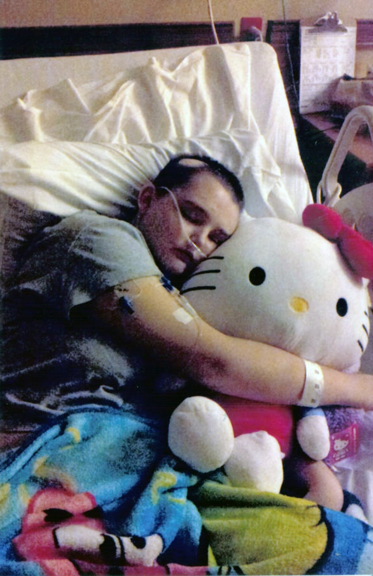 A photo of Janie Fahrendorrf, 18 embracing a stuffed animal while staying at University Medical Center. (Courtesy Photo)