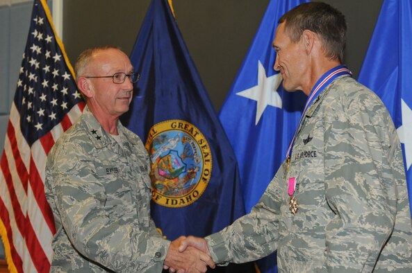 Idaho National Guard Commanding General Maj. Gen. Gary Sayler shakes the hand of retired Col. James R. Compton, previous commander of the 124th Fighter Wing and serving member of the military for 30 over years. (U.S. Air Force photo by TSgt. Becky Vanshur)
