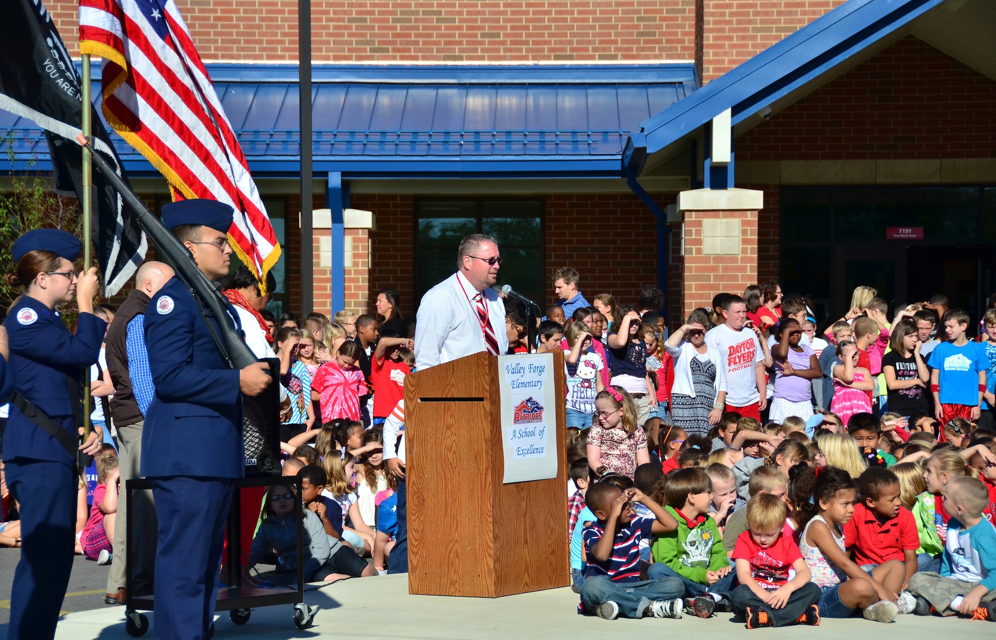 WRIGHT-PATTERSON AIR FORCE BASE, Ohio – Valley Forge Elementary School principal Laurenze Sussman recognizes the men and women from the local police and fire departments and the 445th Airlift Wing during the school’s Patriot Day memorial ceremony Sept. 11.  Twenty five reservists from the wing along with the Wayne High School Air Force Junior Reserve Officer Training Corps Color Guard participated in the ceremony with an audience of 600 Kindergarten through 6th grade students. (U.S. Air Force photo/Stacy Vaughn)