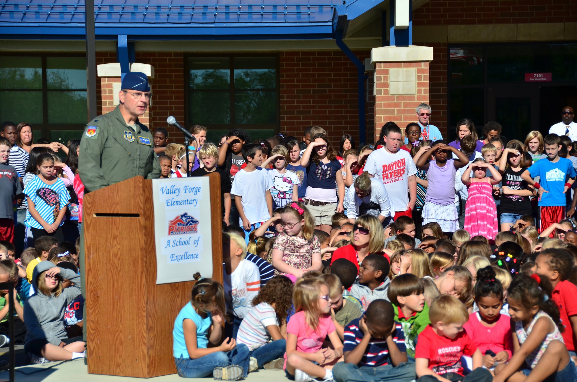 WRIGHT-PATTERSON AIR FORCE BASE, Ohio – Col. Roger Gallet, 445th Airlift Wing special assistant to the wing commander, spoke to more than 600 Kindergarten through 6th grade students at Valley Forge Elementary School, Huber Heights, Ohio, Sept. 11, about serving in the Air Force Reserve. The school hosted a memorial service to honor the men and women of the 445th AW, local police officers and firefighters. (U.S. Air Force photo/Stacy Vaughn)