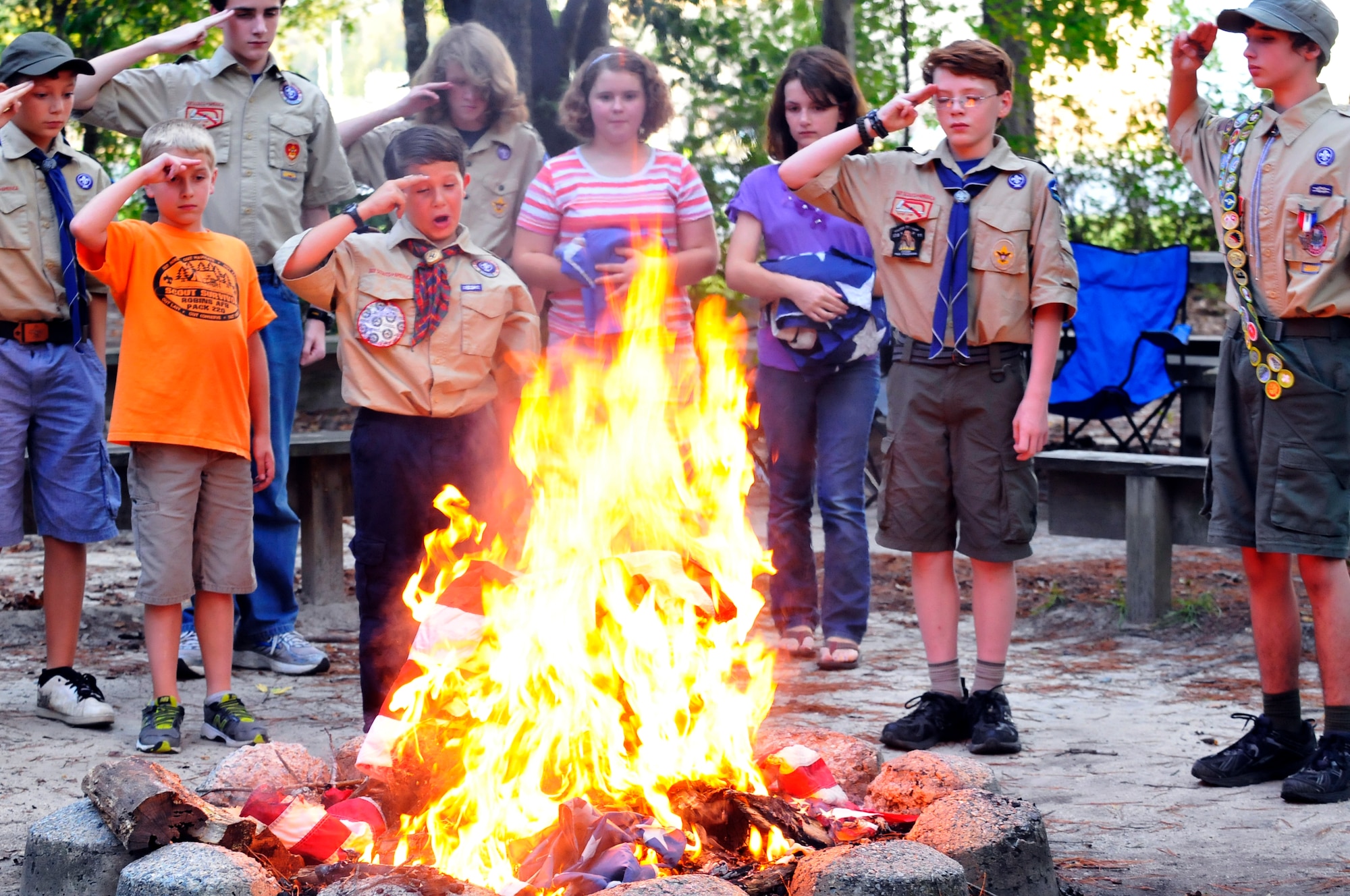 Scouts from Troop and Pack 220 located on Robins AFB honored the remembrance of the eleventh anniversary of 9/11 with a solemn flag retirement ceremony at the Fire Ring near the Pave Paws facility. (U. S. Air Force photo/Sue Sapp)