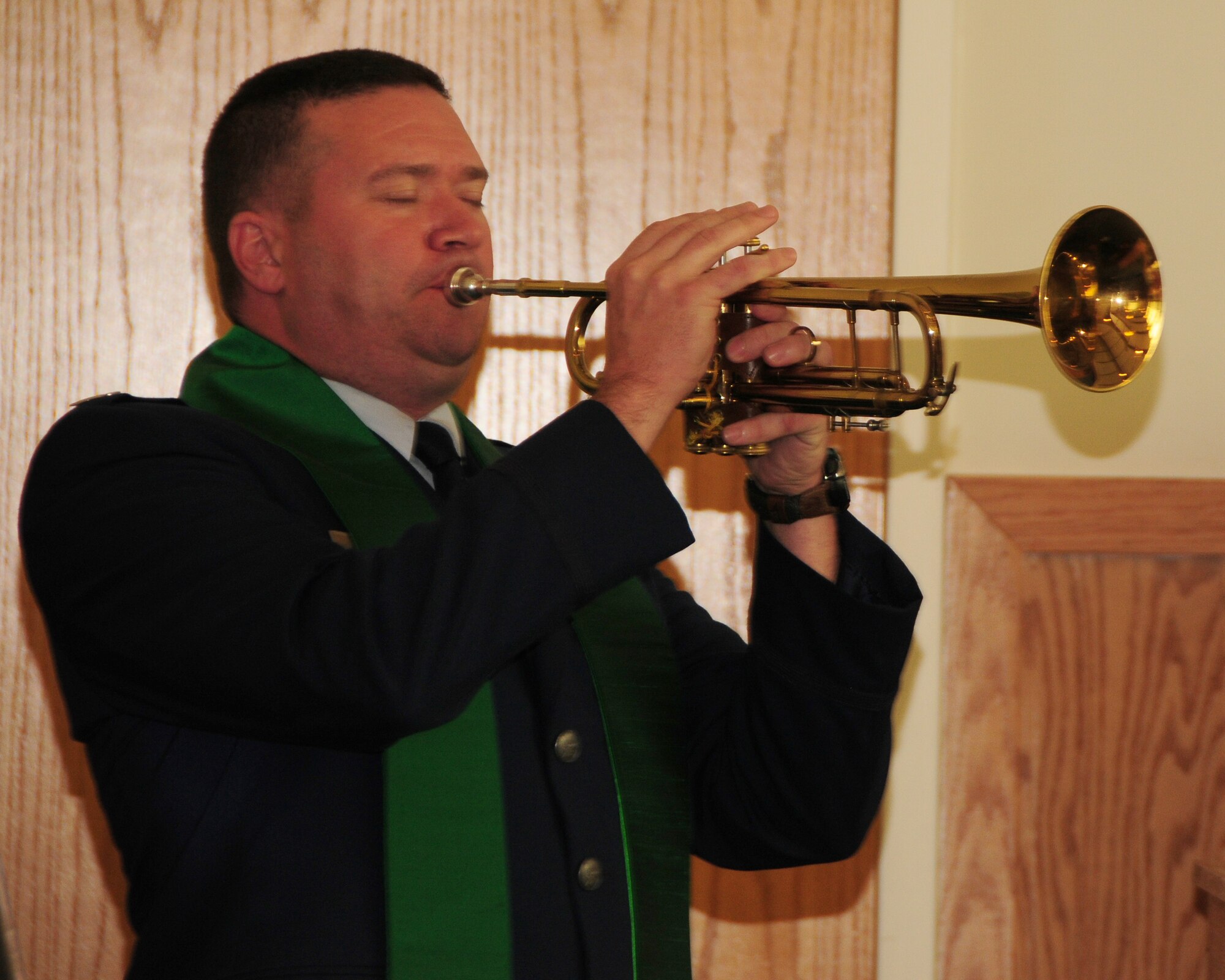 Captain James Bastian, 914th Airlift Wing Chaplain plays taps during an interfaith memorial service at the base chapel, Niagara Falls Air Reserve Station, NY on September 11, 2012. The service was held to remember the tragic day in American History when terrorists attacked this nation.  Bastian led the group in prayer and reflected on the events that happened 11 years ago. (US Air Force photo by Peter Borys)