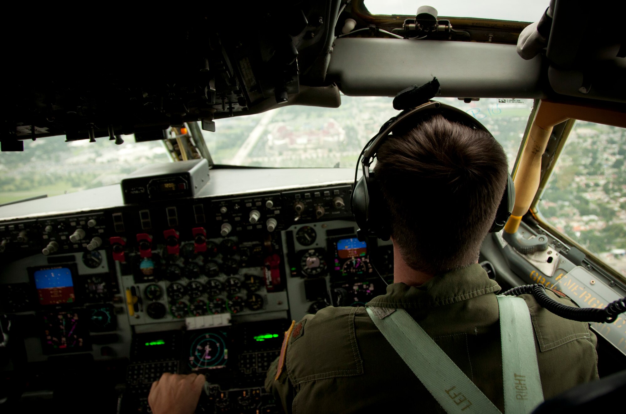 Tampa, Fla. -- Maj. Matt Parker, a pilot with the 91st Air Refueling Squadron at MacDill Air Force Base, Fla., looks on toward the Tampa Buccaneers Stadium prior to a flyover September 7, 2012.  He and other crew members flew the KC-135 Stratotanker over the stadium during the crescendo of the National Anthem at the beginning of the game.  (Official U.S. Air Force photo/Staff Sgt. Shawn Rhodes)
