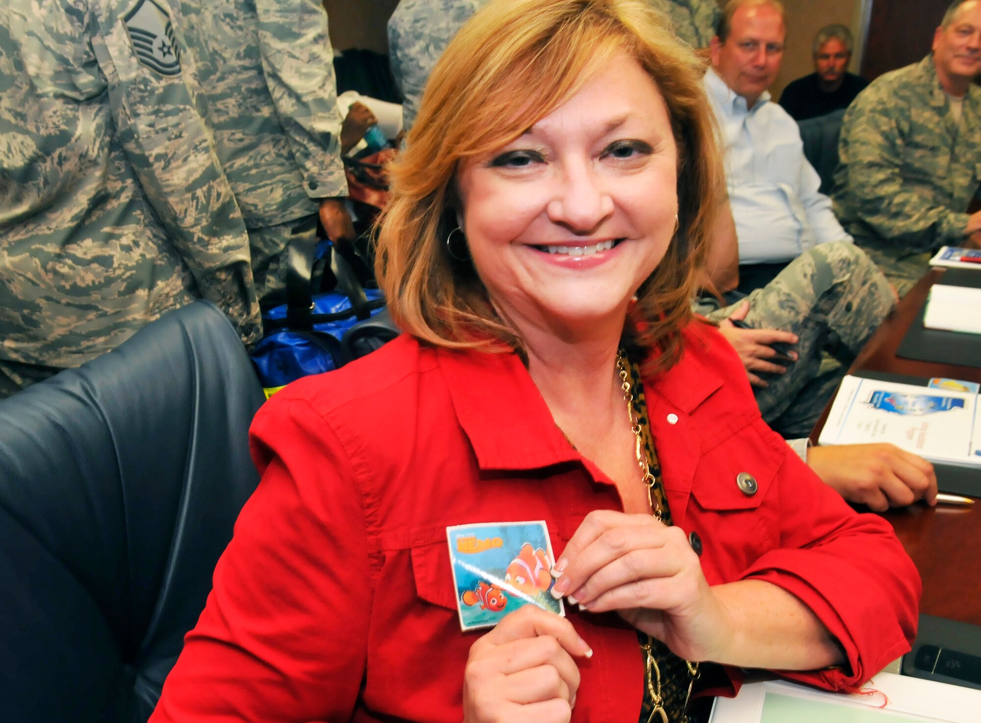 Bonnie Jones, 638th SCMG director, shows off the sticker she was given after getting her flu shot Tuesday.The 78 Medical Group immunization team kicks off the 2012/2013 Influenza Immunization Program Sept 11 by giving flu shots to members of the senior leadership staff. Team Robins personnel are encouraged to get their flu shots in an effort to be proactive regarding the upcoming flu season. (U. S. Air Force photo/Sue Sapp)