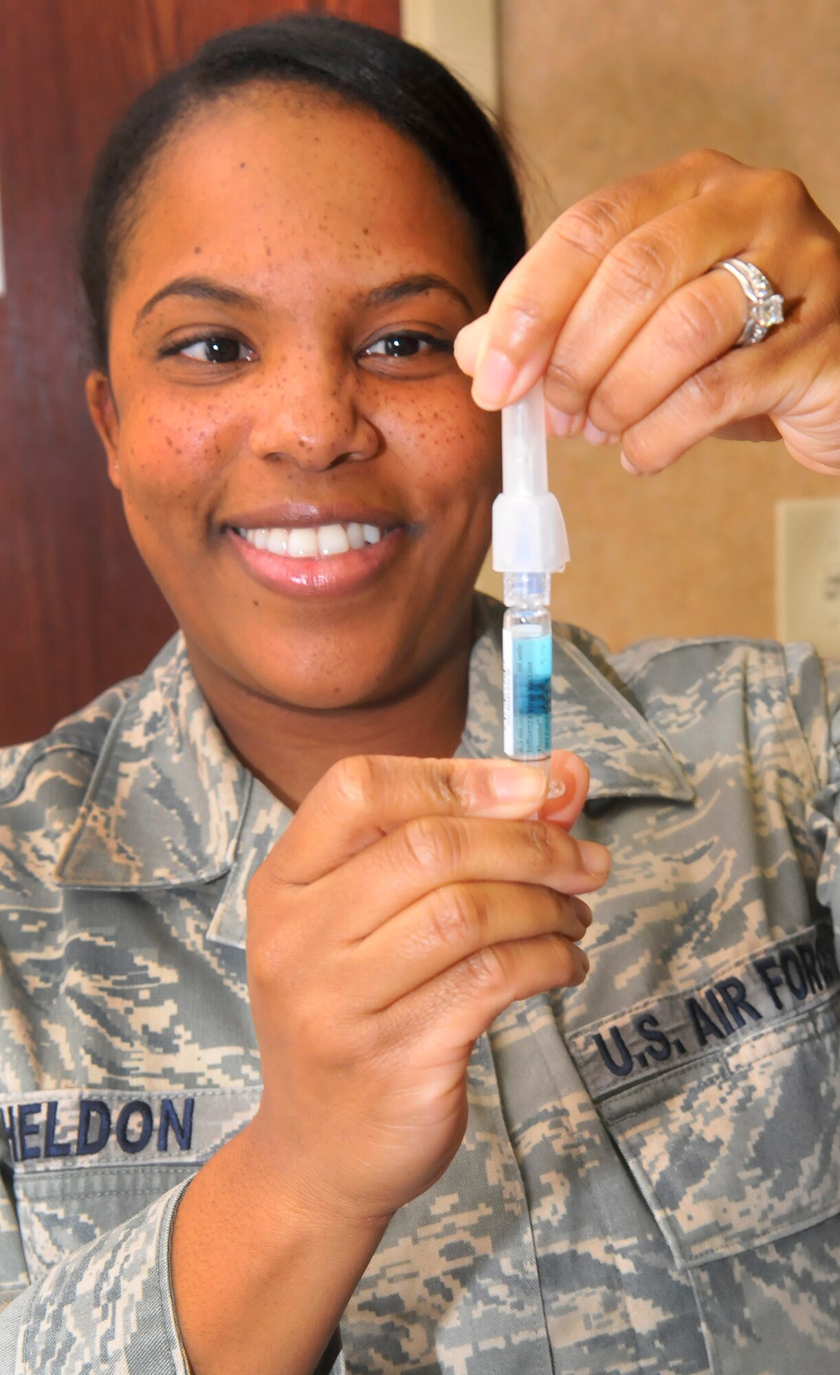 Staff Sgt. Nagelia Shelton, allergy/immunization NCOIC, prepares a flu vacine syringe. The 78 Medical Group immunization team kicks off the 2012/2013 Influenza Immunization Program Sept 11 by giving flu shots to members of the senior leadership staff. Team Robins personnel are encouraged to get their flu shots in an effort to be proactive regarding the upcoming flu season. (U. S. Air Force photo/Sue Sapp)