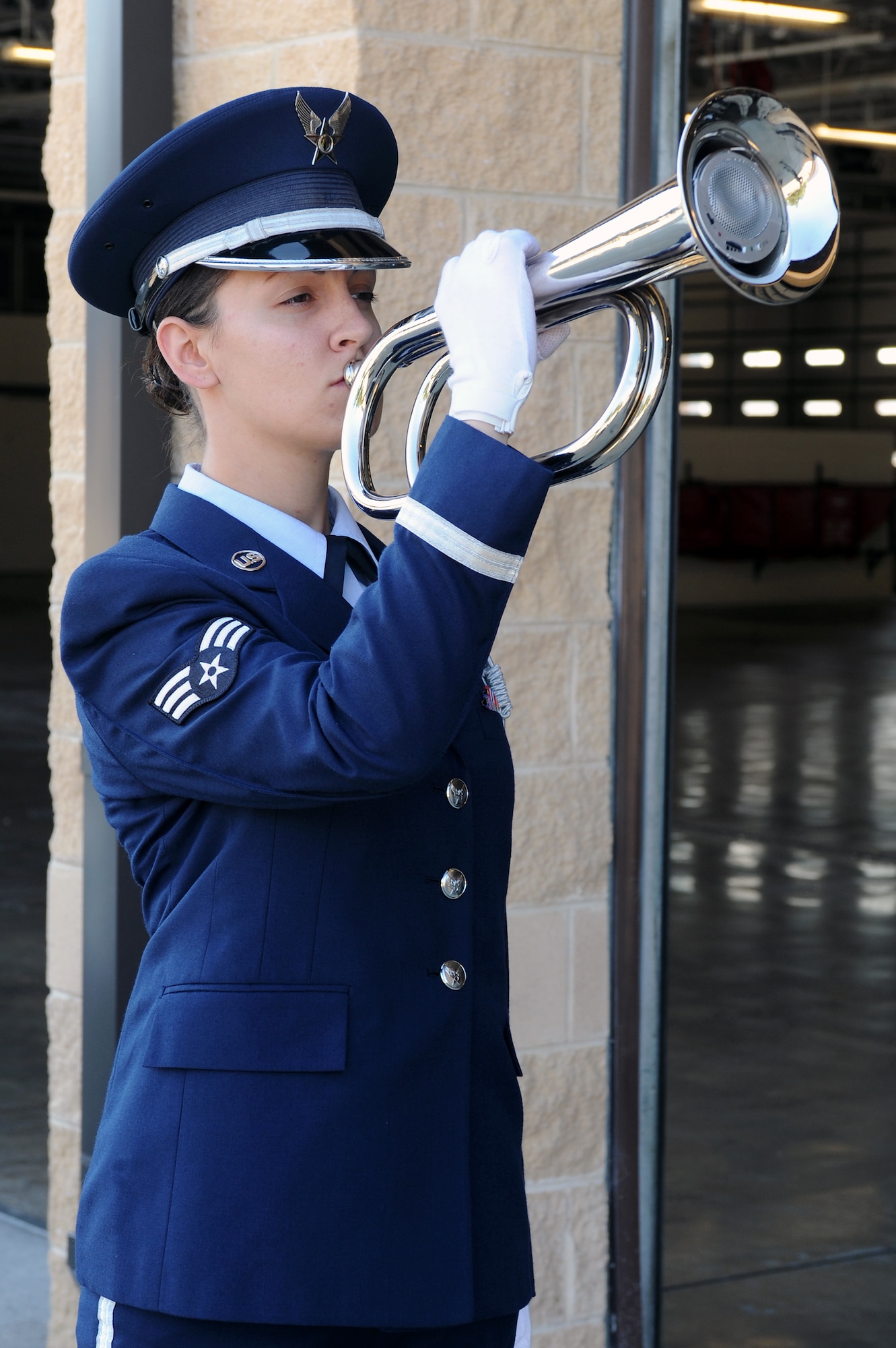 U.S. Air Force Senior Airman Melissa Wallace sounds TAPS during the 9/11 Remembrance Ceremony on Seymour Johnson Air Force Base, N.C., Sept. 11, 2012. The hour-long ceremony included a color guard consisting of firemen and defenders, a slide show documenting the terrorist attacks, four guest speakers and a 21-gun salute by 4th Fighter Wing Base Honor Guard Airmen. (U.S. Air Force photo/Airman 1st Class John Nieves Camacho/Released)