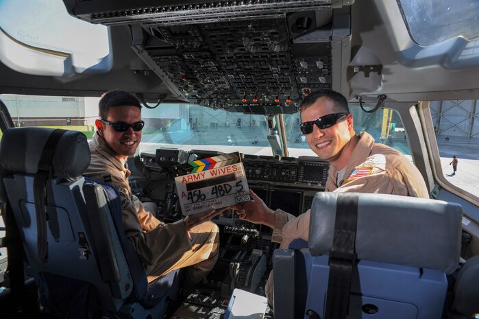 Capt. Jake Fox and Capt. Luke Berreckman, 437th Airlift Wing pilots, fly the C-17 Globemaster III during the filming of the Lifetime drama series Army Wives at Joint Base Charleston - Air Base June 20, 2012. Army Wives tells the story of four women and one man who are brought together by their common bond -- they all have military spouses. The series is based on the book "Under the Sabers: The Unwritten Code of Army Wives" by Tanya Biank. Army Wives is produced by ABC Television Studio and The Mark Gordon Company. (U.S. Air Force photo/Airman 1st Class Ashlee Galloway)