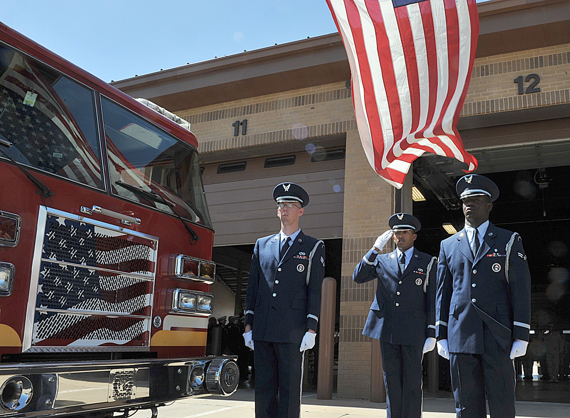 A McConnell Honor Guard member salutes the flag during a Patriot Day Retreat Ceremony Sept. 11, 2012, McConnell Air Force Base, Kan.  Patriot Day occurs on September 11 of each year and is designated in memory of those killed in the 9/11 terrorist attacks. (U.S. Air Force photo/Airman 1st Class Maurice A. Hodges)
