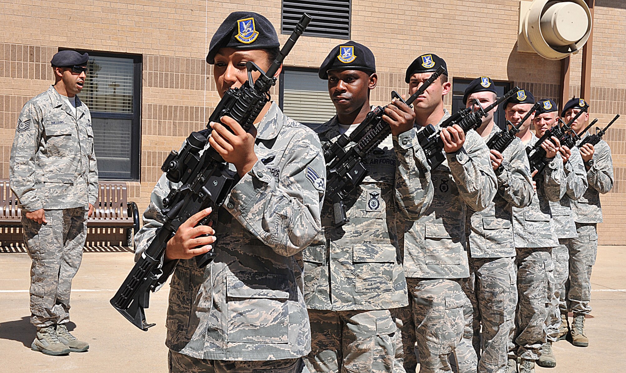 Tech. Sgt. Terrance Williams, 22nd Security Forces Squadron gate section NCO in charge, commands the firing squad during a Patriot Day Retreat Ceremony Sept. 11, 2012, McConnell Air Force Base, Kan.  The Airmen rendered honors to show respect for the ones who have fallen during 9/11. (U.S. Air Force photo/Airman 1st Class Maurice A. Hodges)