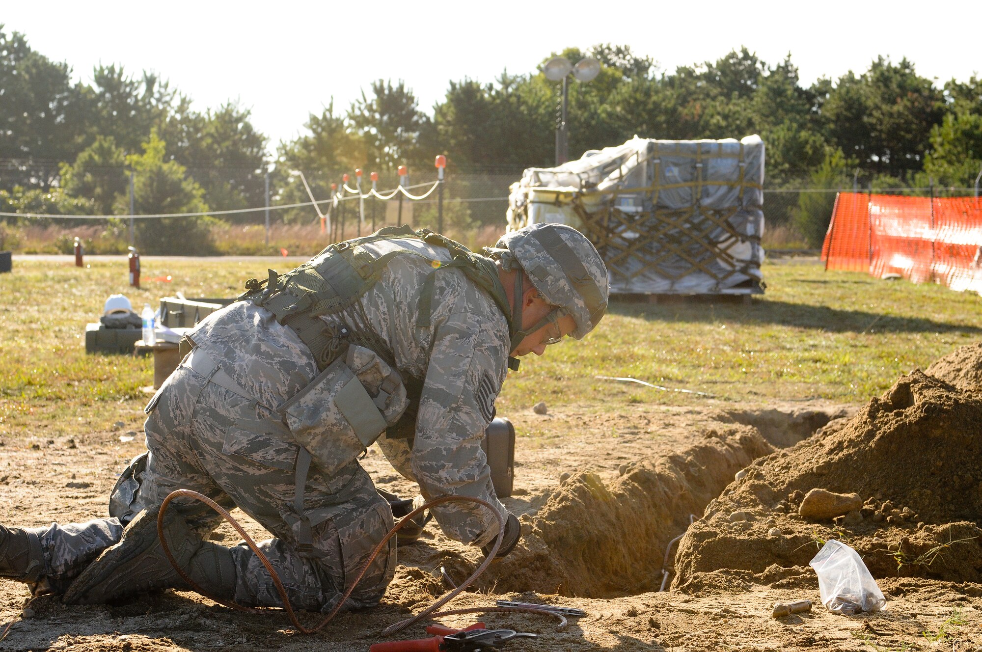 Tech. Sgt. Nicola Galante, 267th Combat Communications Squadron (267 CBCS), prepares to assemble a delta ground wiring system, which stabilizes voltage to the earth, during the buildup of a simulated deployed communications site during an Operational Readiness Inspection (ORI) at Otis Air National Guard Base, Mass., Sept. 10.  The primary mission of the 267 CBCS is to deploy, operate, and maintain strategic dispersal of emergency communications anywhere in the world. (Air National Guard photo by Tech. Sgt. Kerri Cole/Released)