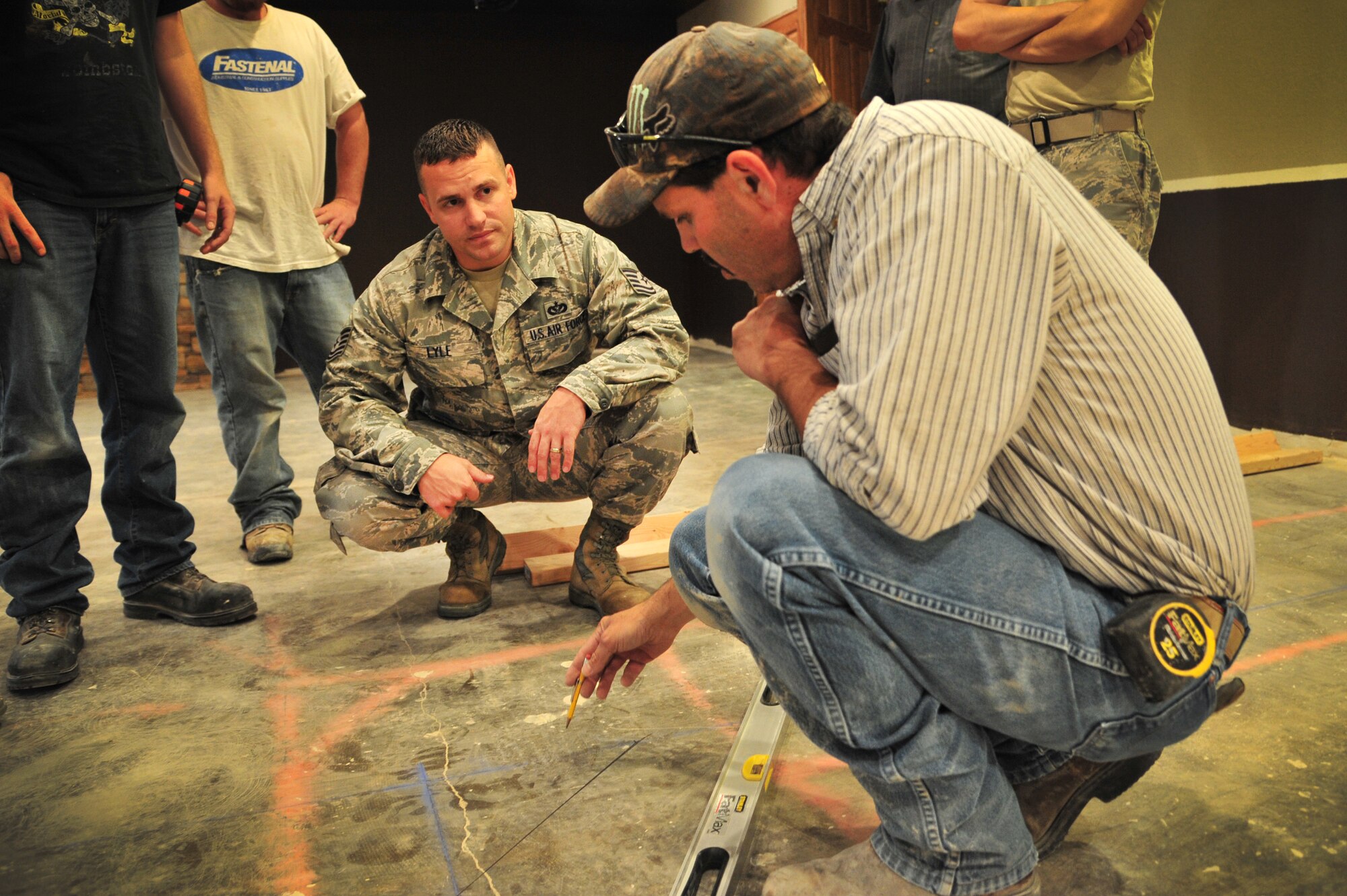 U.S. Air Force Tech. Sgt. Shaun Lyle, 27th Special Operations Civil Engineer Squadron Specialized Maintenance Team member, works on floor plans with another SMT member for the reconstruction of the Tumbleweed Lounge in The Landing Zone at Cannon Air Force Base, N.M., Sept. 7, 2012. Air Commandos with the SMT are saving the wing countless dollars by taking on full renovations of the lounge as part of an in-house job. (U.S. Air Force photo/Airman 1st Class Alexxis Pons Abascal)  