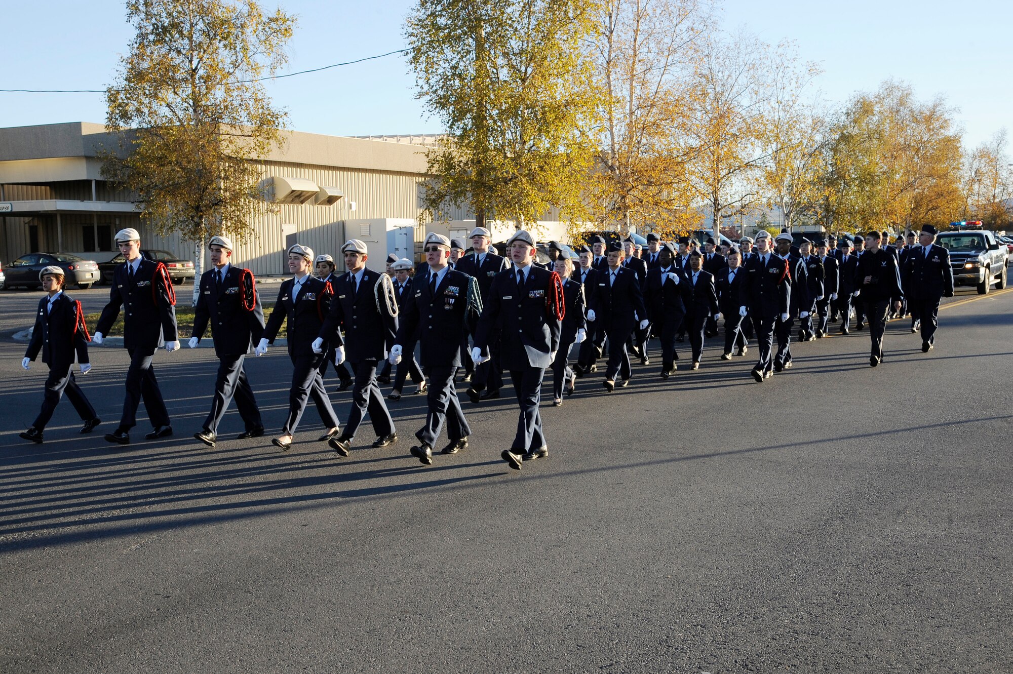 Air Force Junior ROTC cadets march in formation during a parade honoring Patriot Day Sept. 11, 2012, Eielson Air Force Base, Alaska. The cadets marched from Ben Eielson Junior-Senior High School to Amber Hall where they performed a reveille ceremony in remembrance of 9/11. (U.S. Air Force photo/Staff Sgt. Jim Araos)