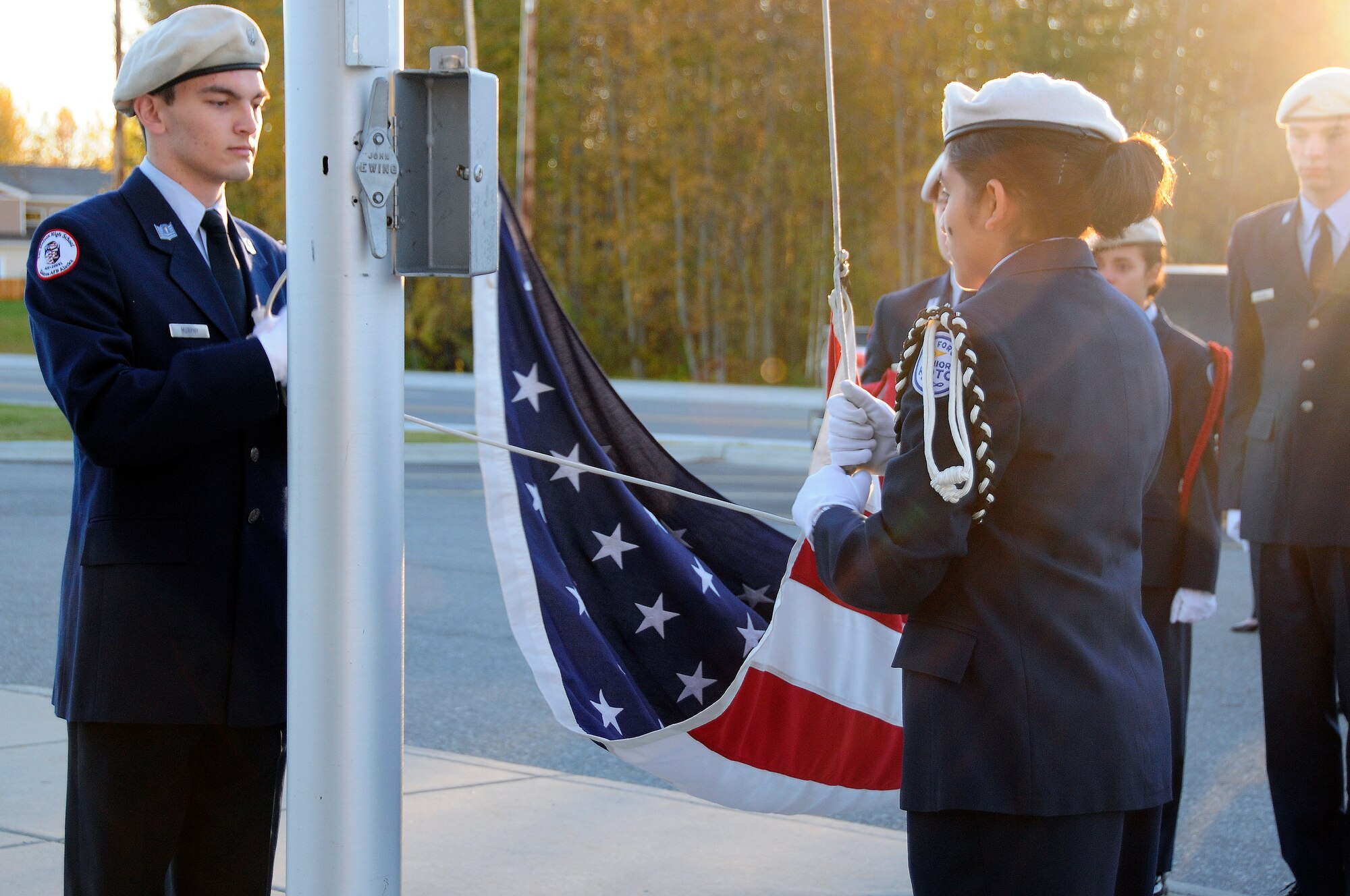 Ben Eielson High School Air Force Junior ROTC cadets prepare to raise the American flag for reveille in honor of Patriot Day at the Ben Eielson Junior-Senior High School Sept. 11, 2012, Eielson Air Force Base, Alaska. The cadets lowered the flag to half-staff in remembrance of those who lost their lives on 9/11. (U.S. Air Force photo/Airman 1st Class Zachary Perras)