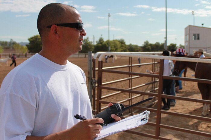 Mitchell Retzlaff, A U.S. Air Force Tech Sgt. and space system operator with the 328th Weapons School, registers contestants during the 4th annual Red, White and Blue Jeans Walk-Trot Sept. 8, 2012 at Horseman's Park, Las Vegas, Nev. Airmen from the USAFWPS supported the Red, White and Blue Walk-Trot and Hero Appreciation Day. (U.S. Air Force photo by Senior Airman Daniel Hughes)