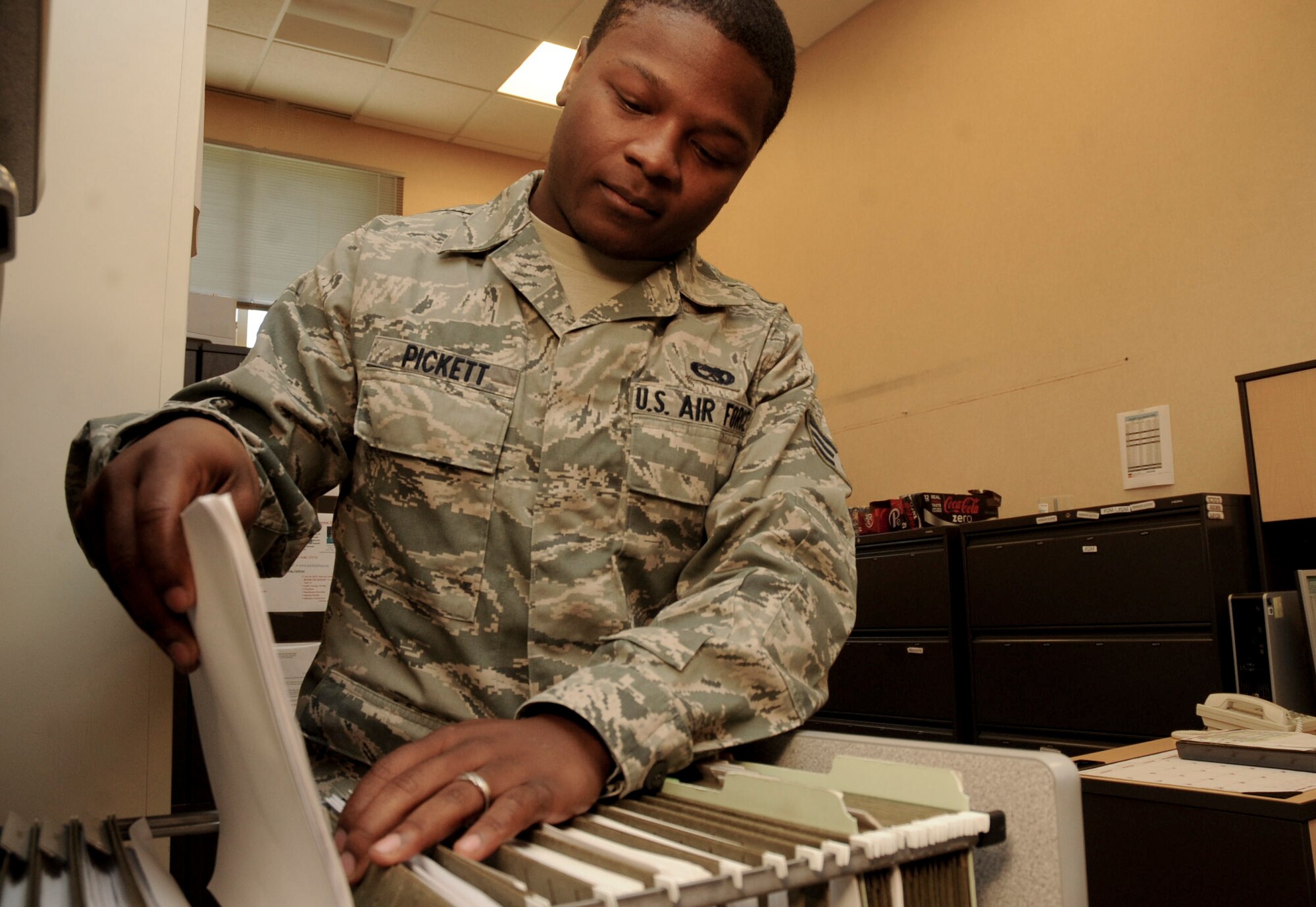 Senior Airman Dontrai Pickett, 34th Bomb Squadron scheduler, files weekly aircraft maintenance schedules at the 37th Bomb Squadron at Ellsworth Air Force Base, S.D., Sept. 7, 2012. Carefully managed maintenance schedules are crucial to ensuring the unit’s aircraft are ready and able to accomplish its mission.  (U.S. Air Force photo by Airman 1st Class Anania Tekurio/Released)