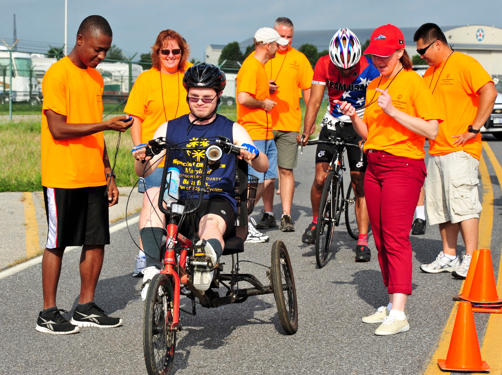 Mark Springuel (center) begins the 10K race during the Delaware Special Olympic cycling event Sept. 8 at Dover Air Force Base, Del. More than 120 volunteers donated their time to help 42 participants compete in the event.  (U.S. Air Force photo by Master Sgt. Jeanette Spain)